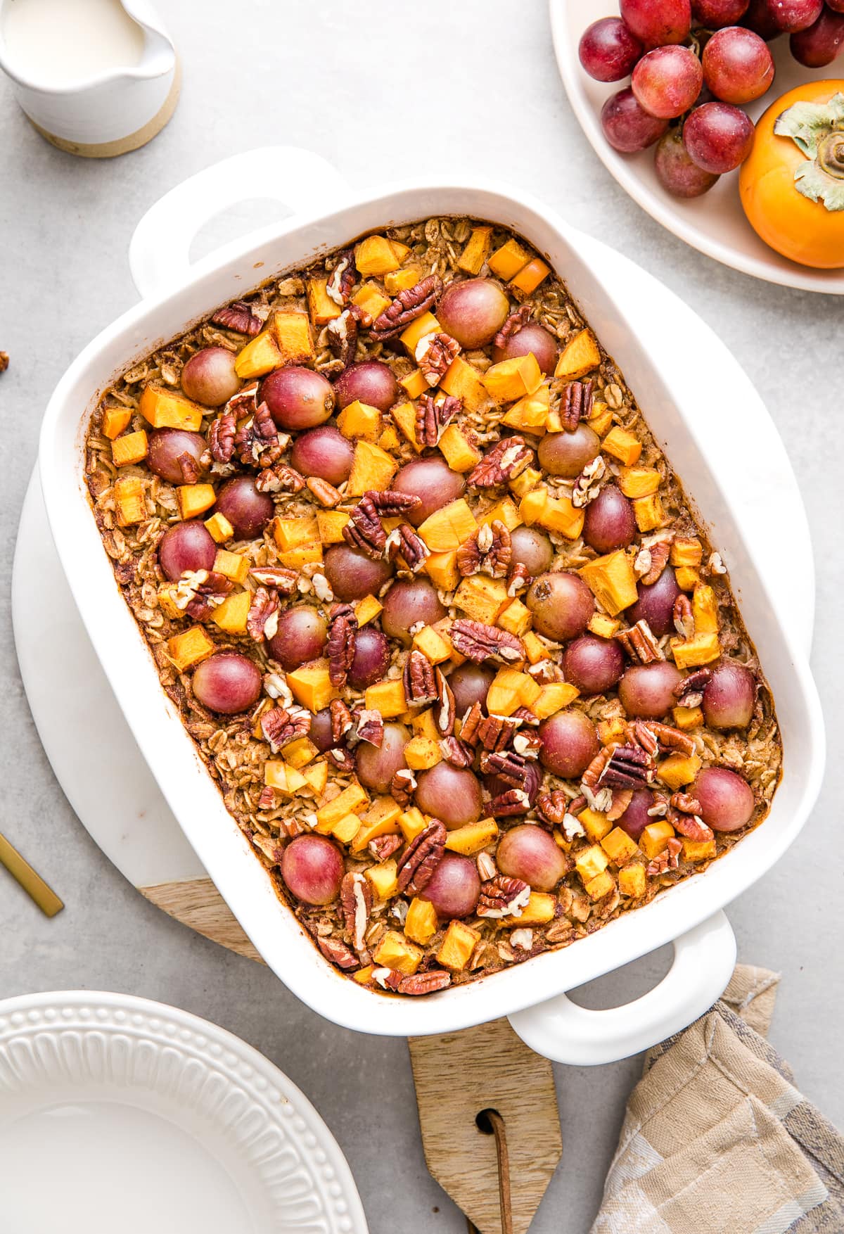 top down view of freshly made persimmon and grape baked oatmeal.