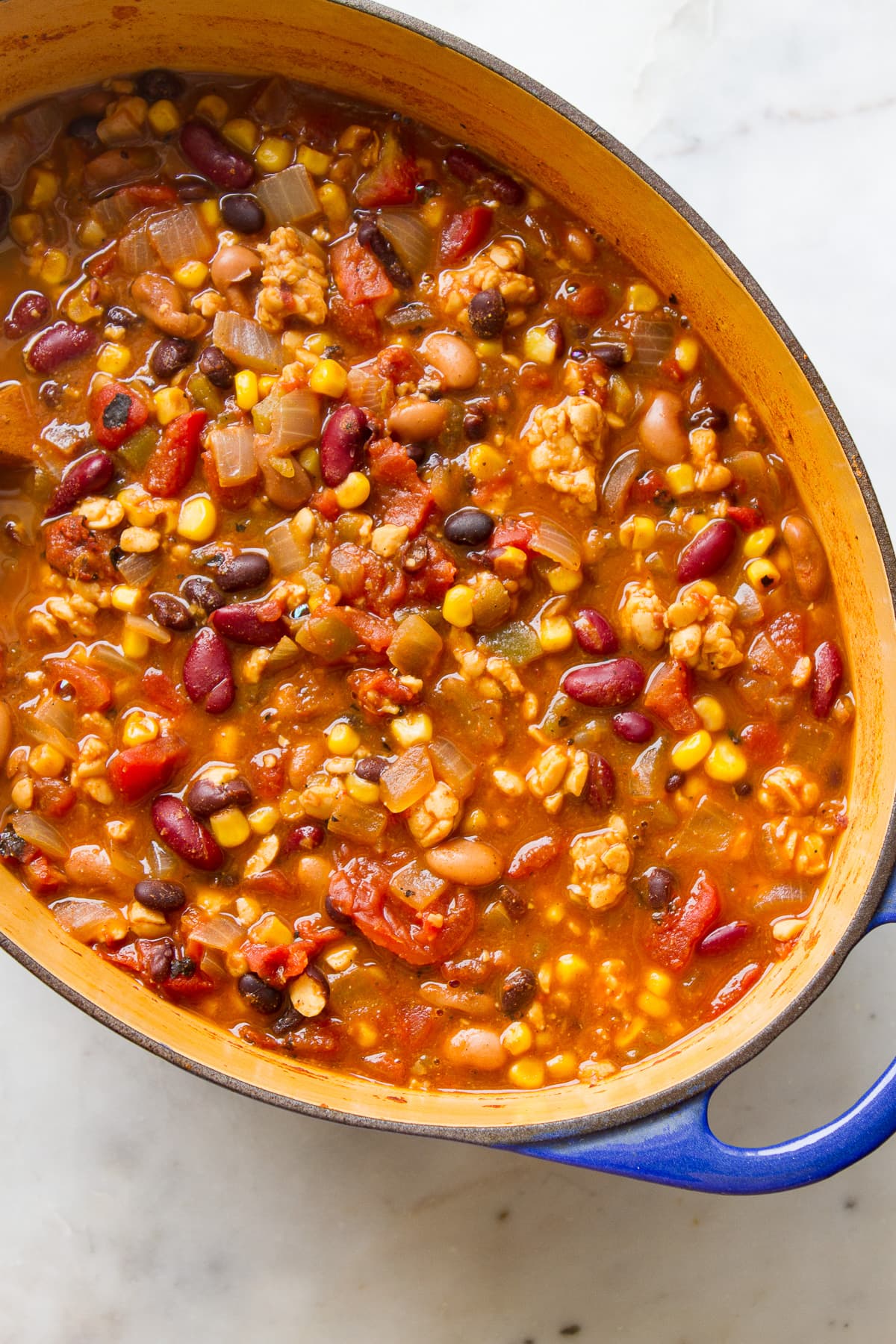 top down view of dutch oven with freshly made tempeh chili.