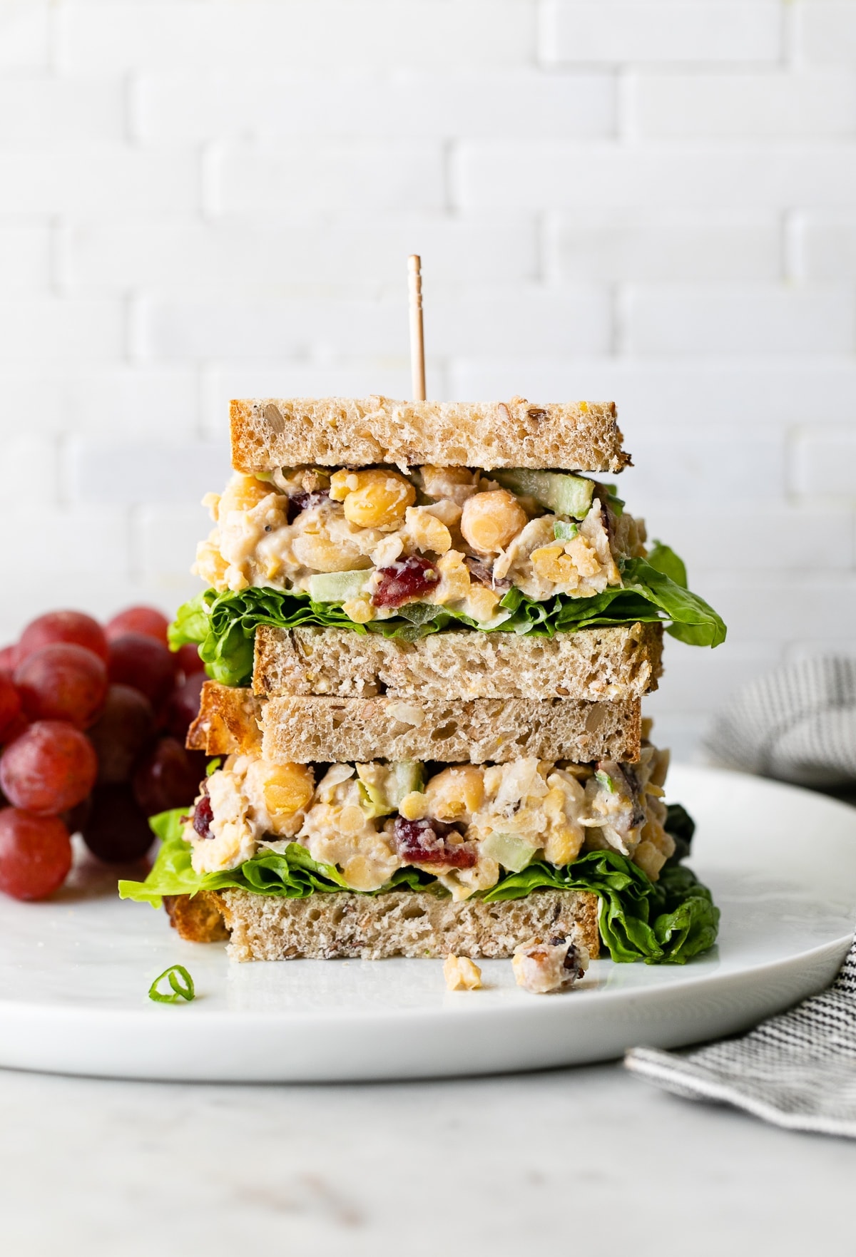 head on view of chickpea salad sandwich on a plate.