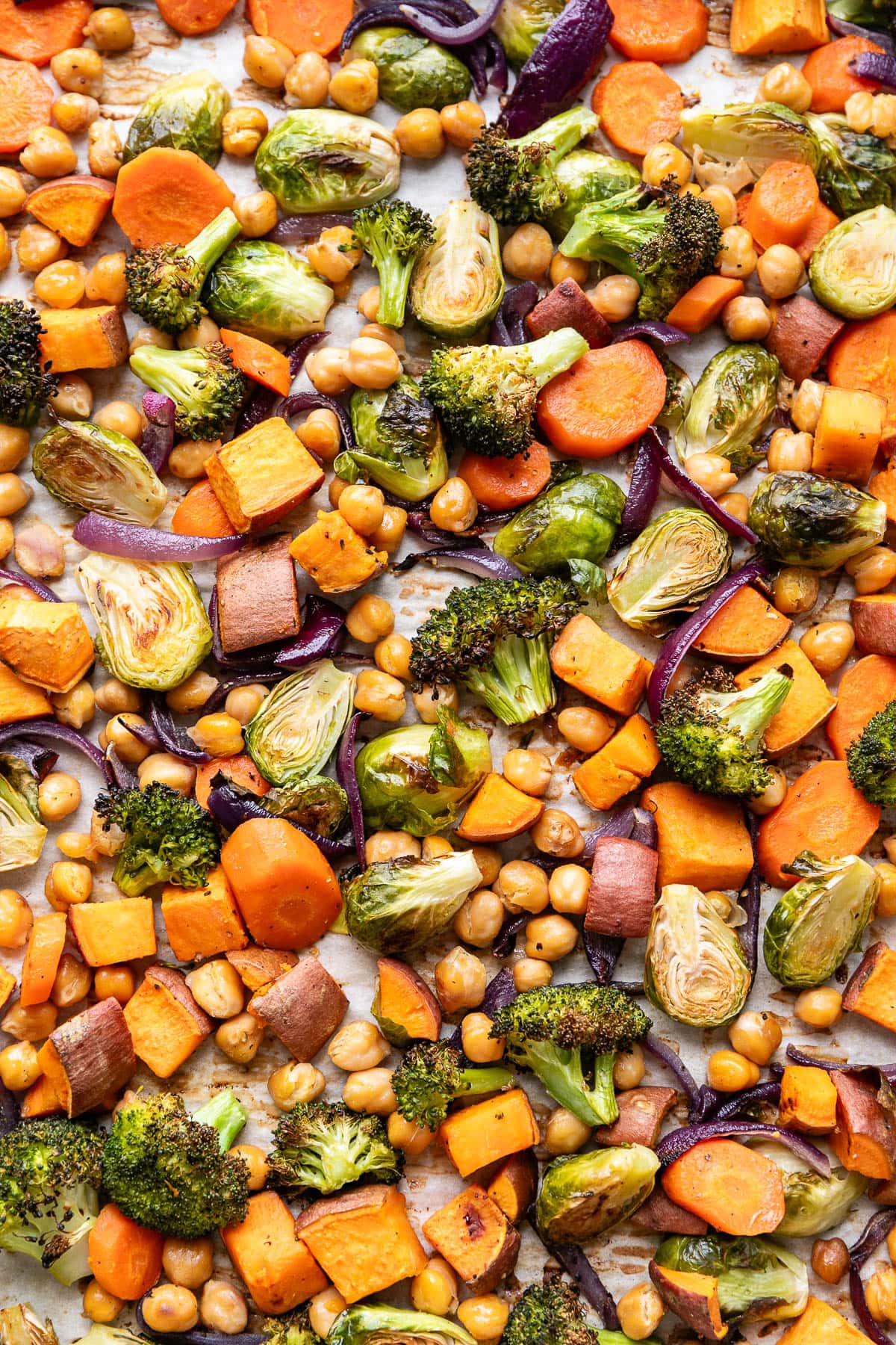 top down view of fresh roasted veggies on a baking sheet.