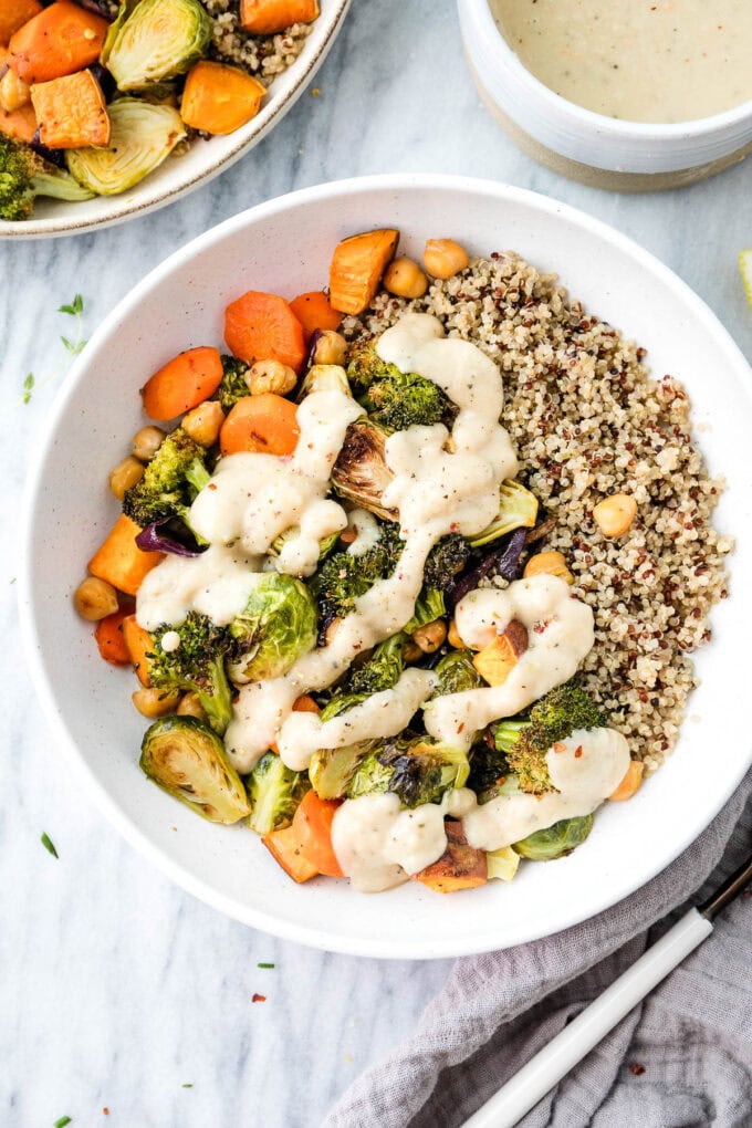 top down view of roasted veggies with white bean sauce in a bowl.