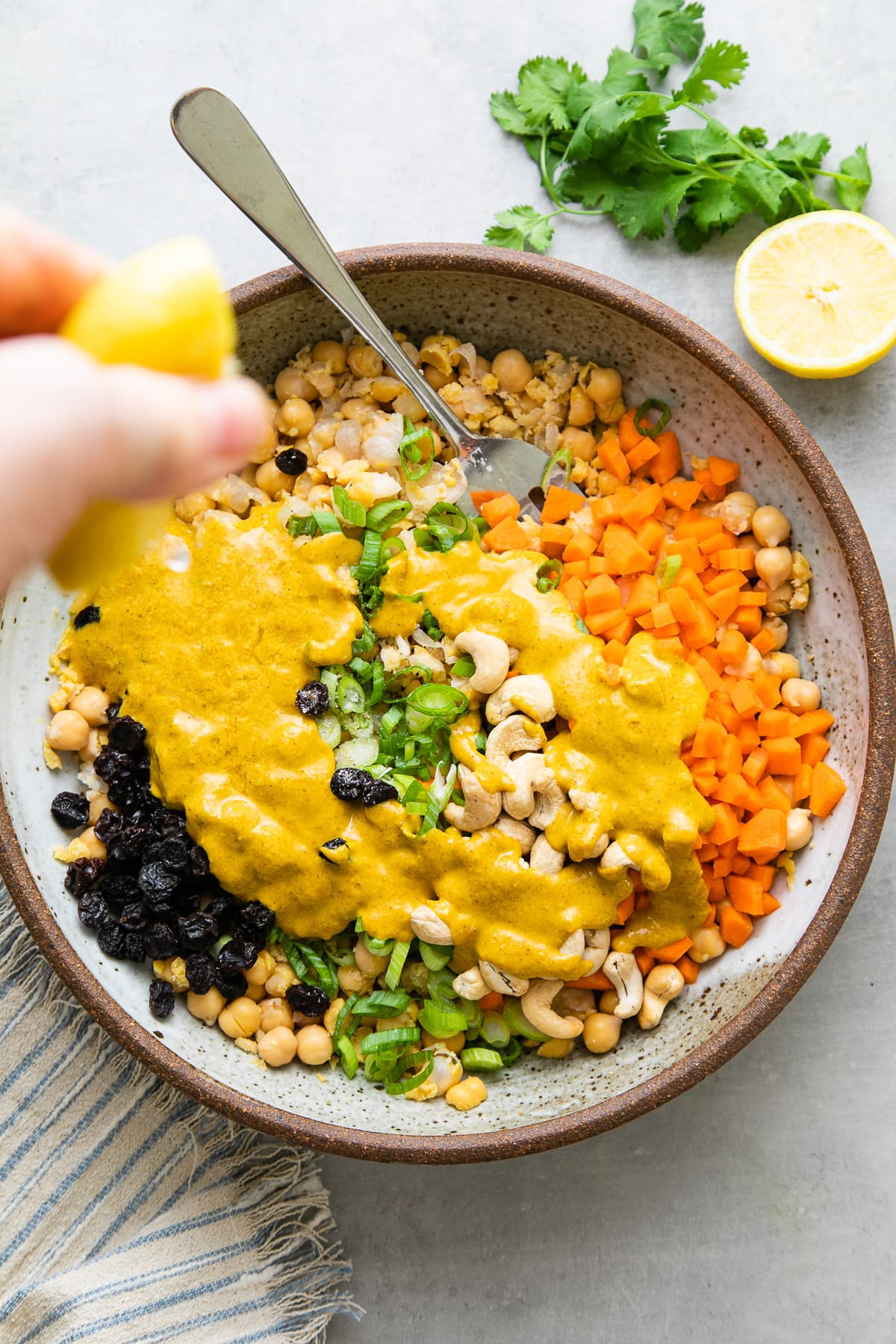 top down view of curried chickpea salad ingredients added to bowl before mixing.