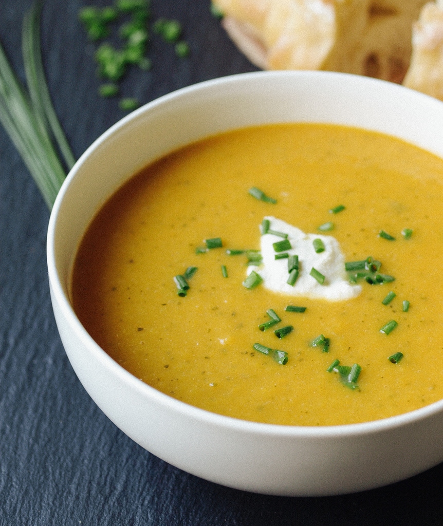 side angle view of Zucchini & Sweet Potato Vichyssoise in a white bowl.