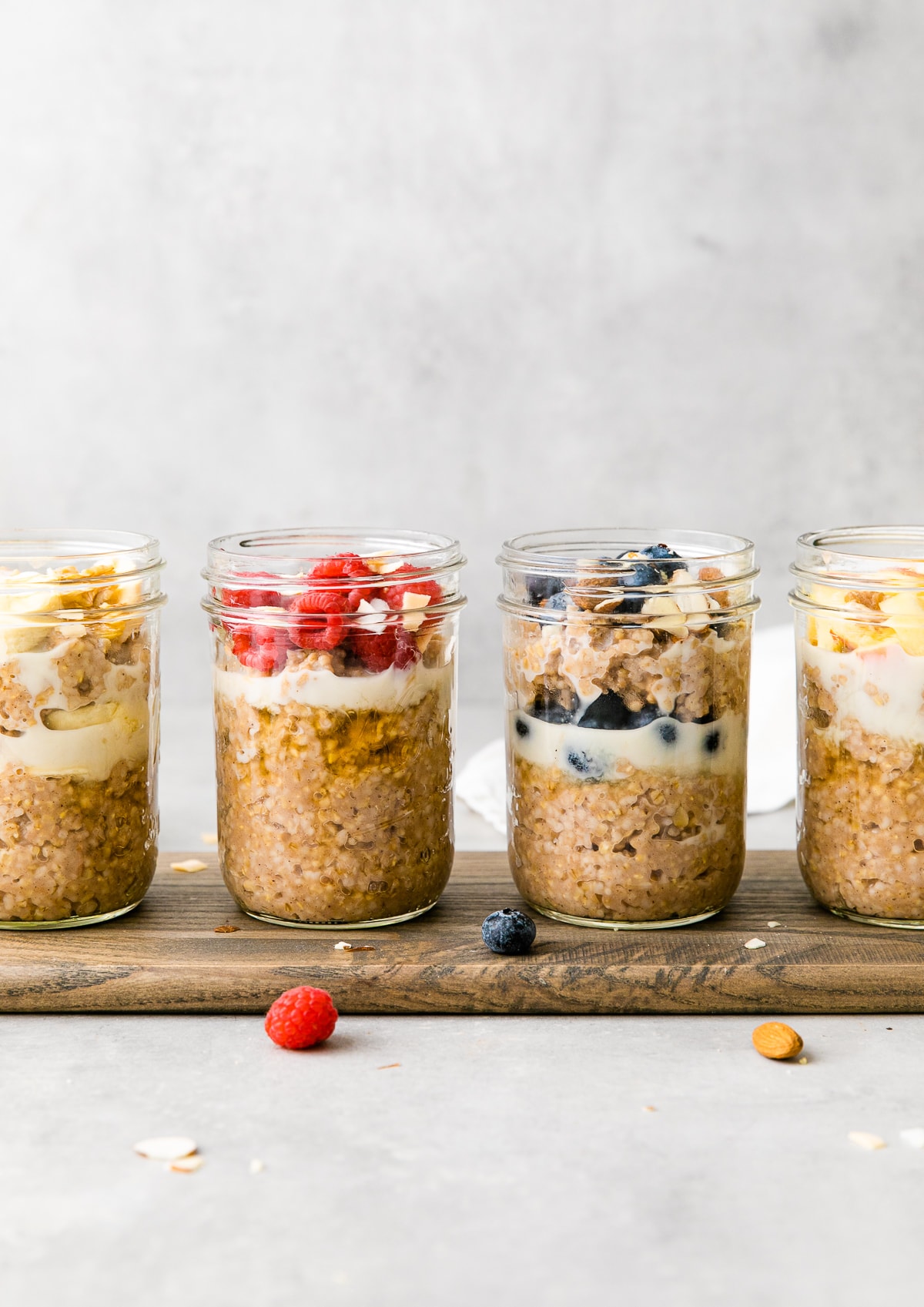 head on view of 4 steel cut breakfast jars with flavorful toppings.