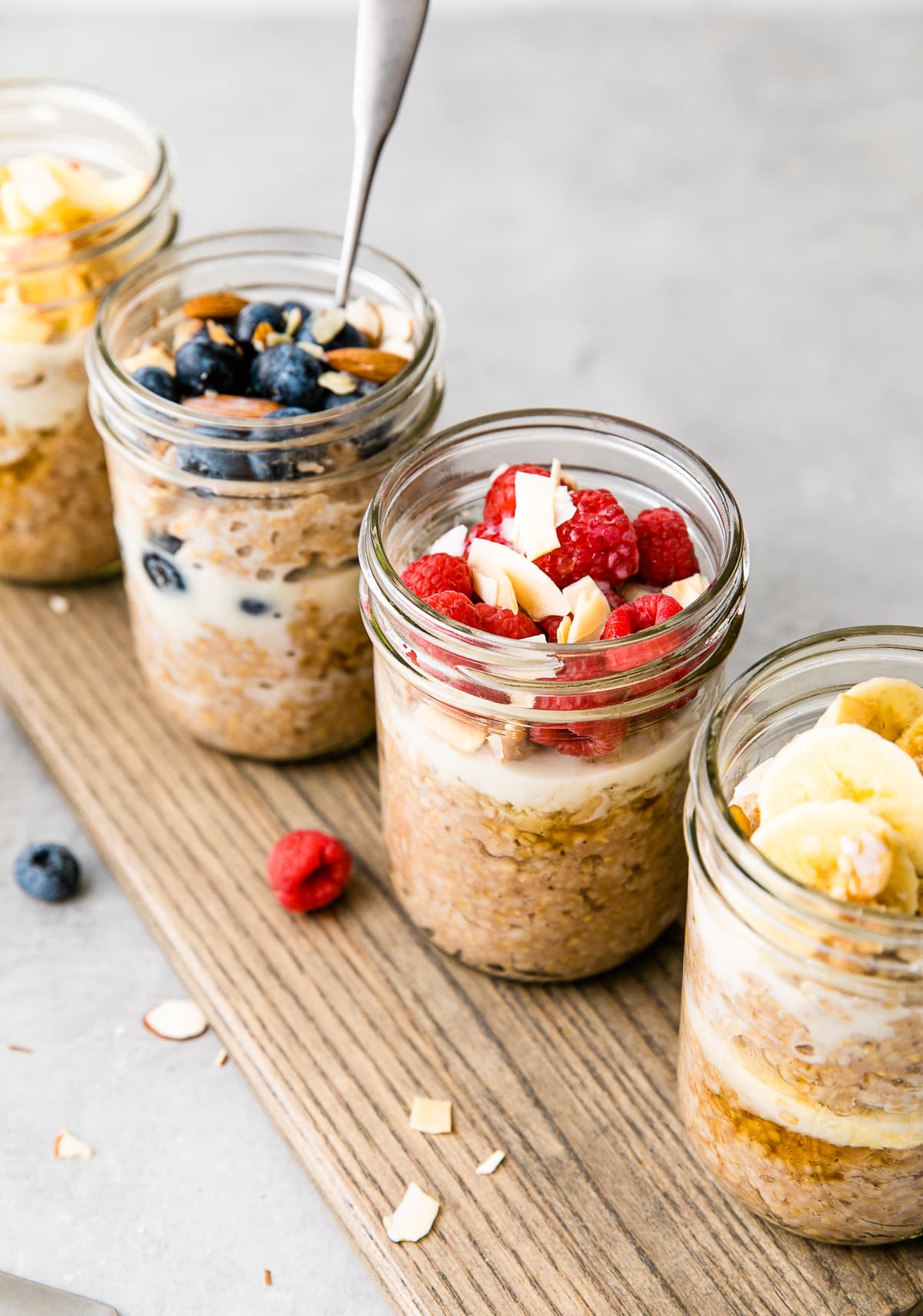 head on view of 4 steel cut breakfast jars with flavorful toppings.