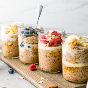 head on view of 4 steel cut breakfast jars with flavorful toppings.