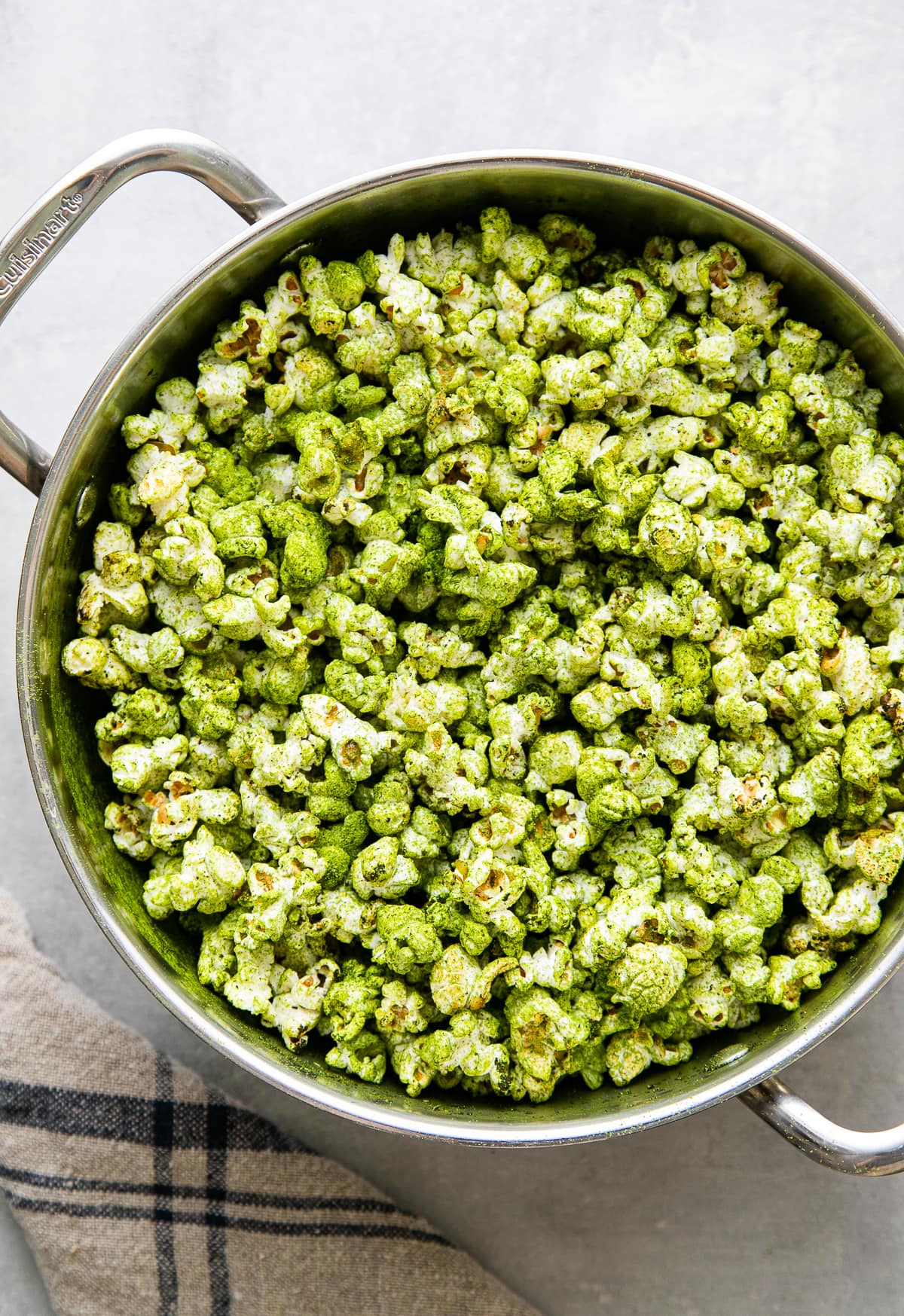top down view of freshly made stovetop popcorn with green matcha.