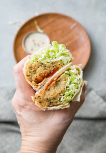 top down view of quinoa lentil wraps cut in half and held.