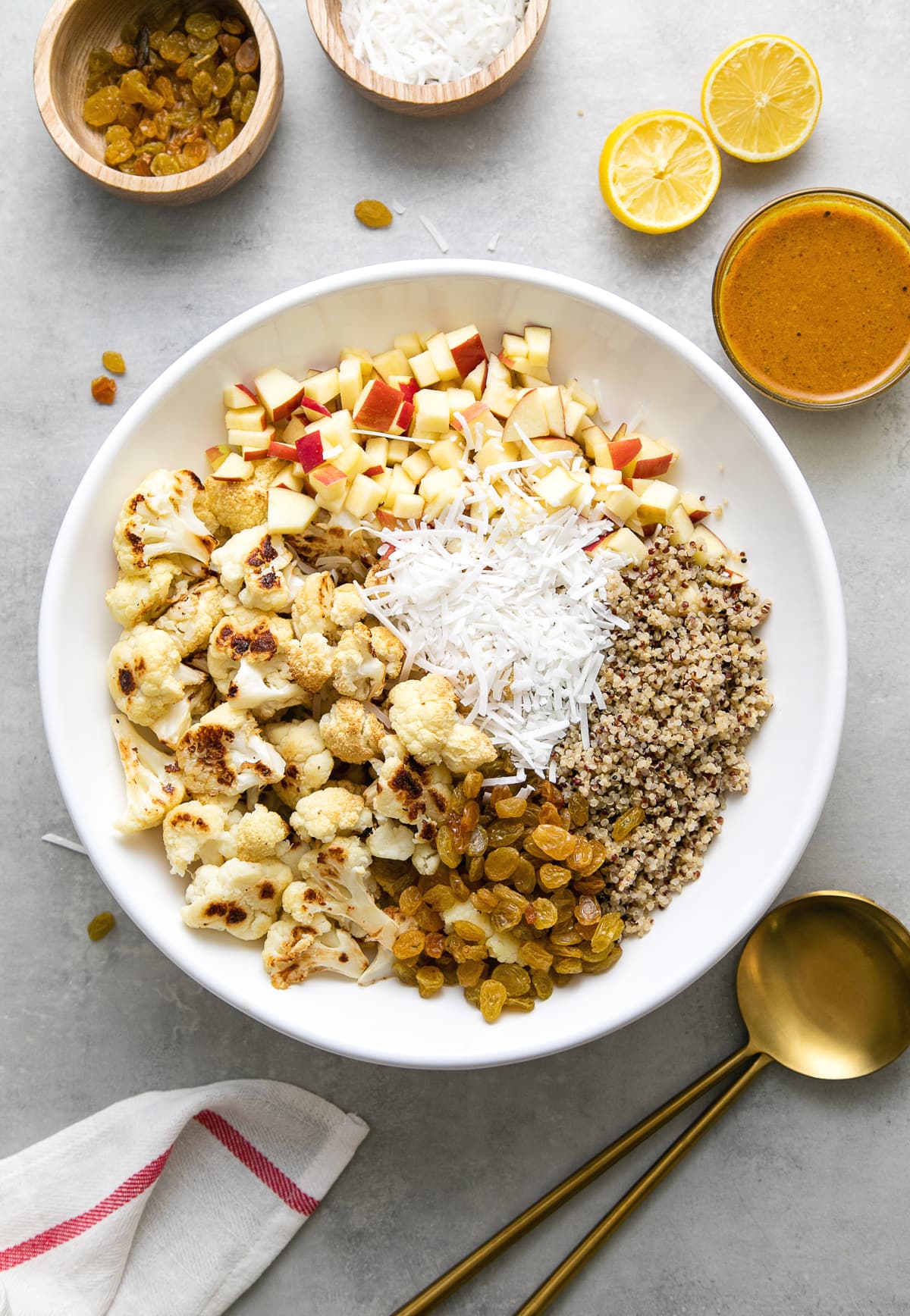 top down view of ingredients added to a bowl with items surrounding.