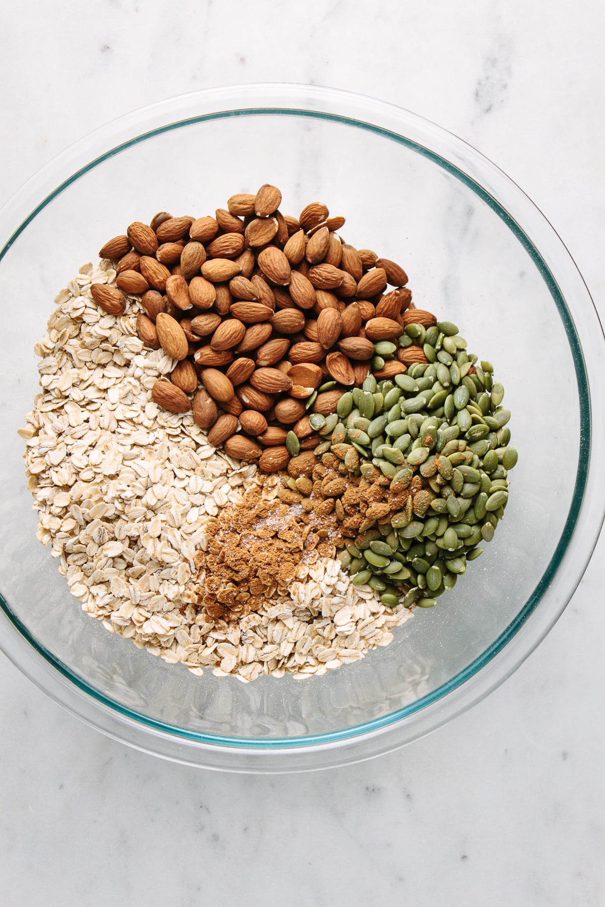 top down view of dry ingredients add to bowl for making peanut butter granola snack cluster granola.