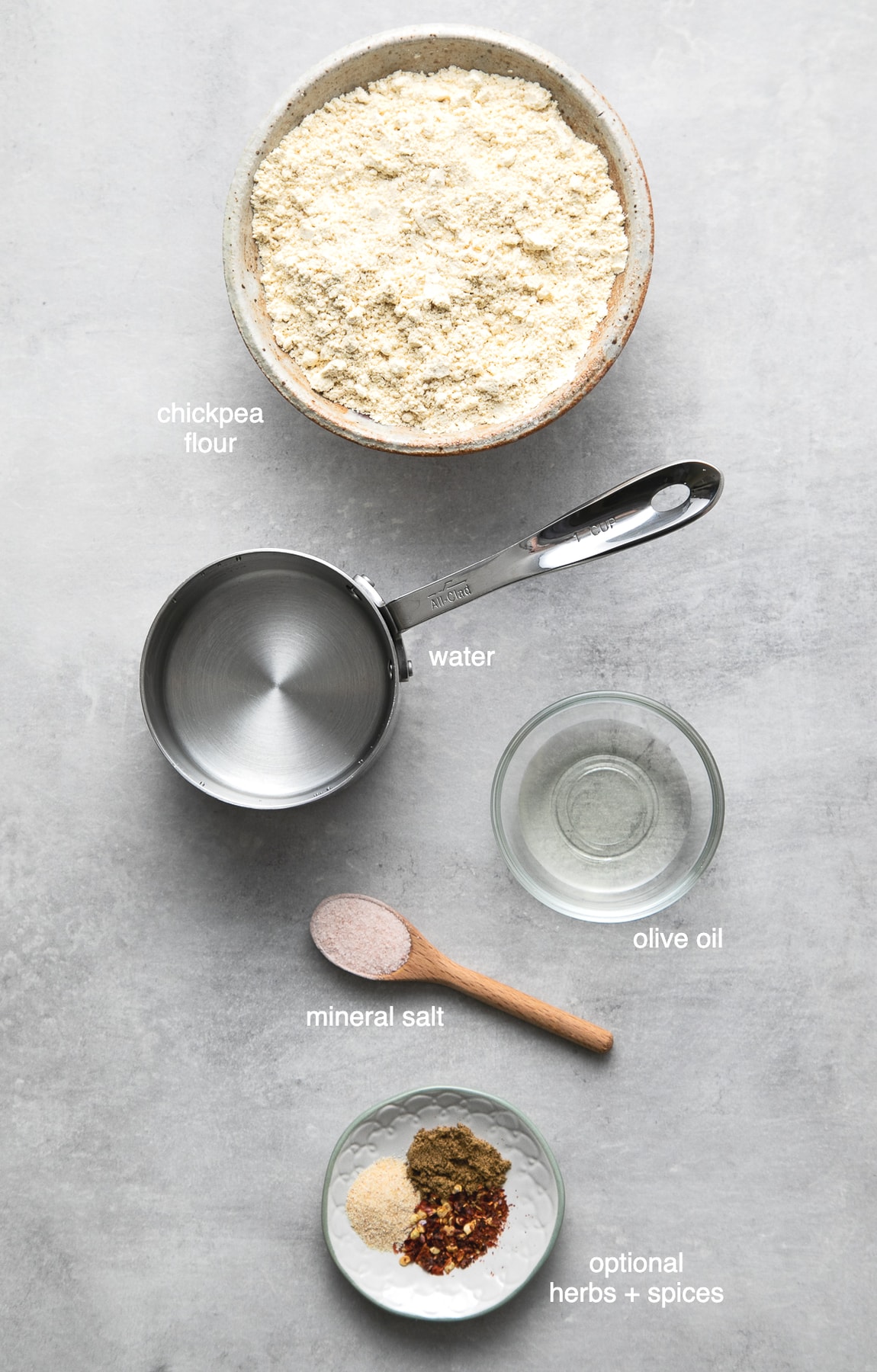 top down view of ingredients used to make socca farinata flatbread using chickpea flour.