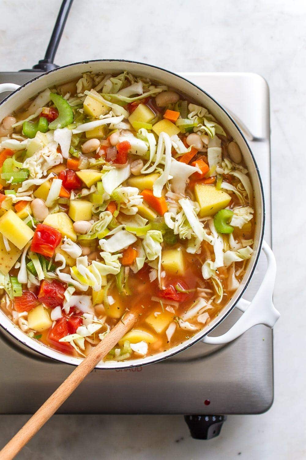 top down view of cabbage potato soup before simmering. 