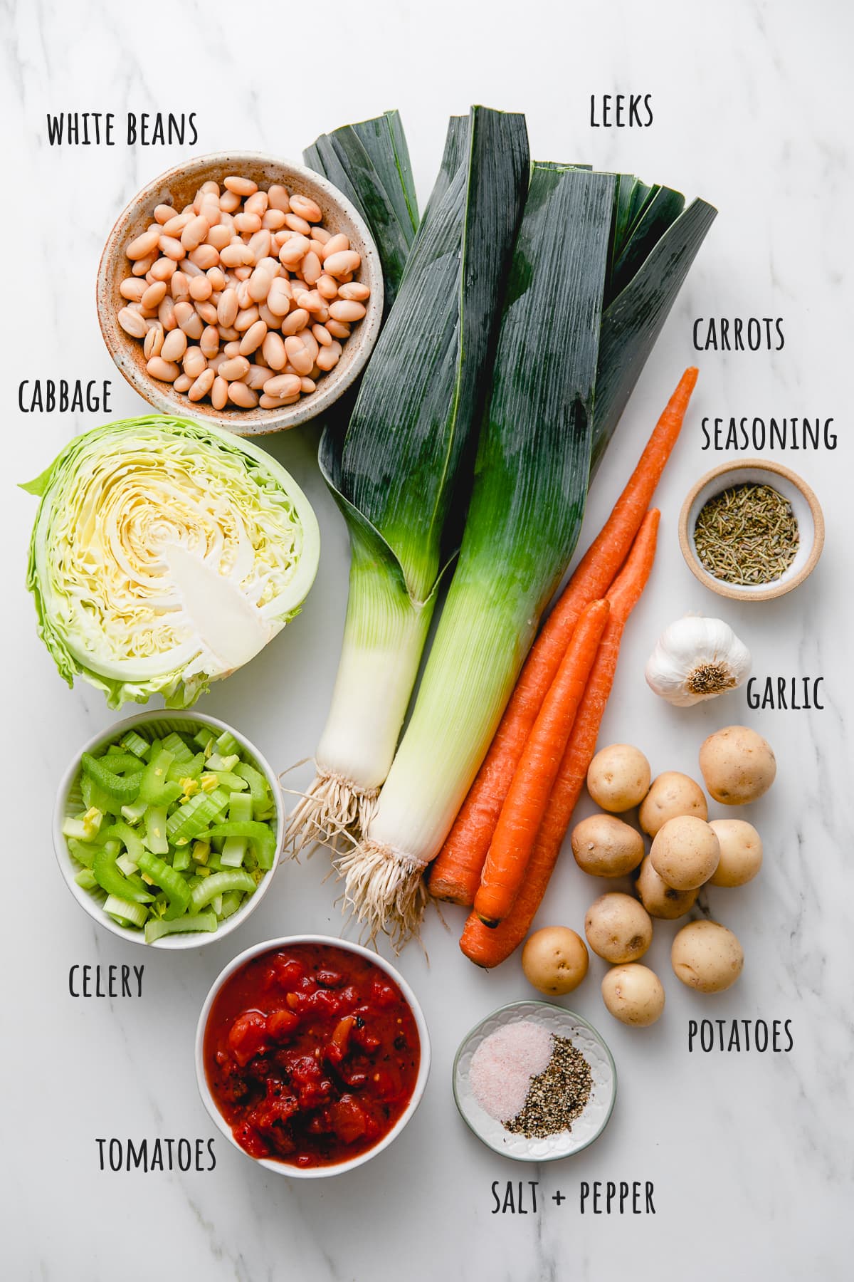 top down view of ingredients used to make potato cabbage white bean soup recipe.