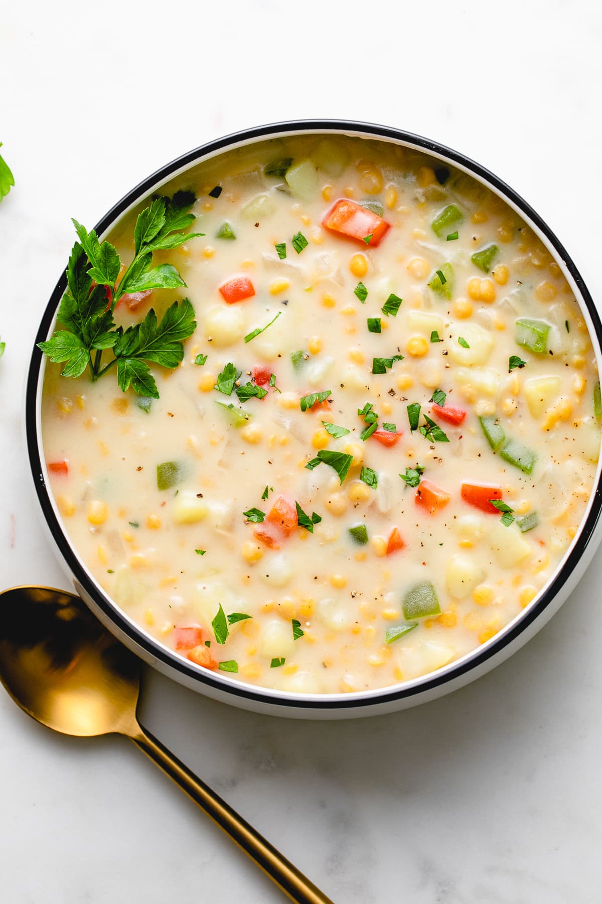 top down view of bowl of vegan chana dal sweet potato chowder.