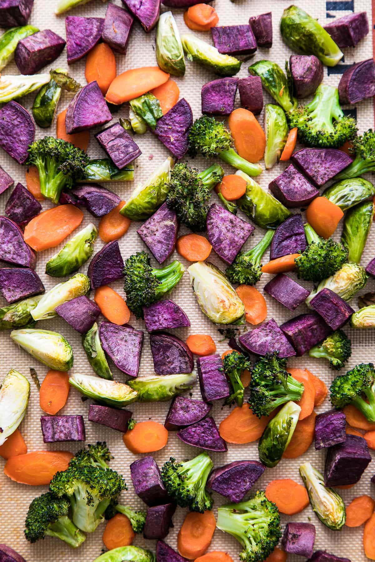 top down view of roasted veggies on a baking sheet.