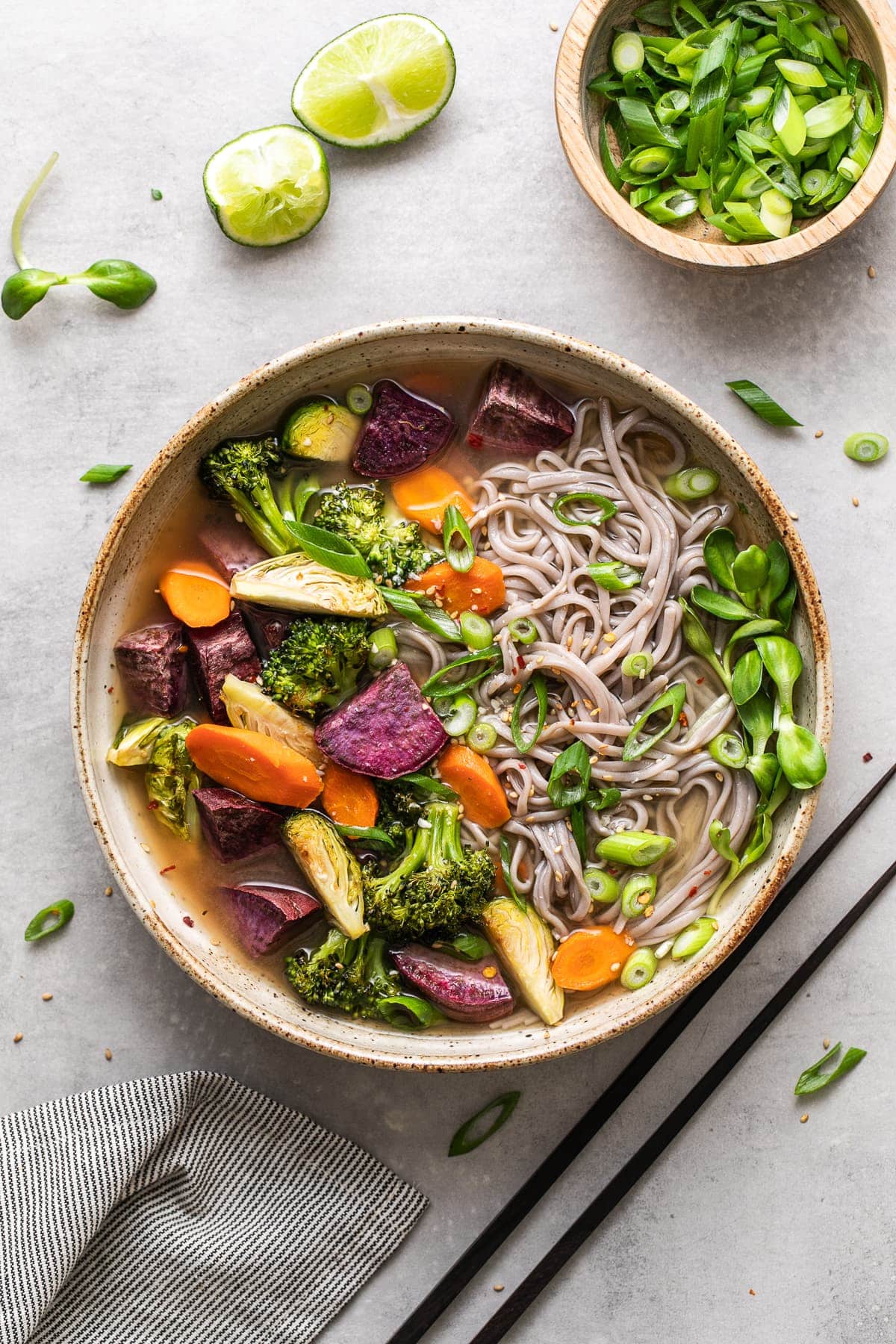 top down view of soba miso soup with roasted vegetables in a bowl.