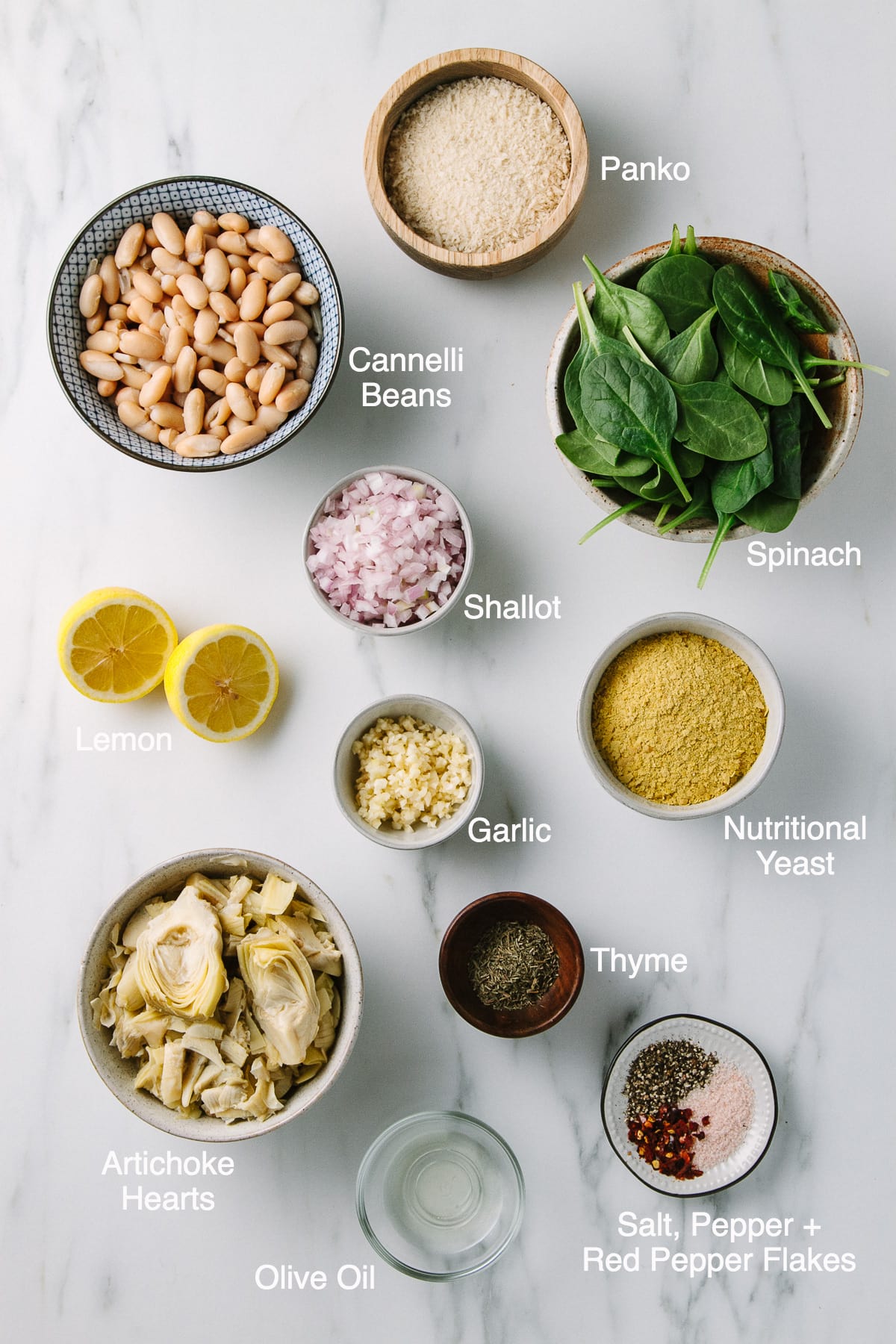 top down view of ingredients needed to make spinach artichoke white bean dip.