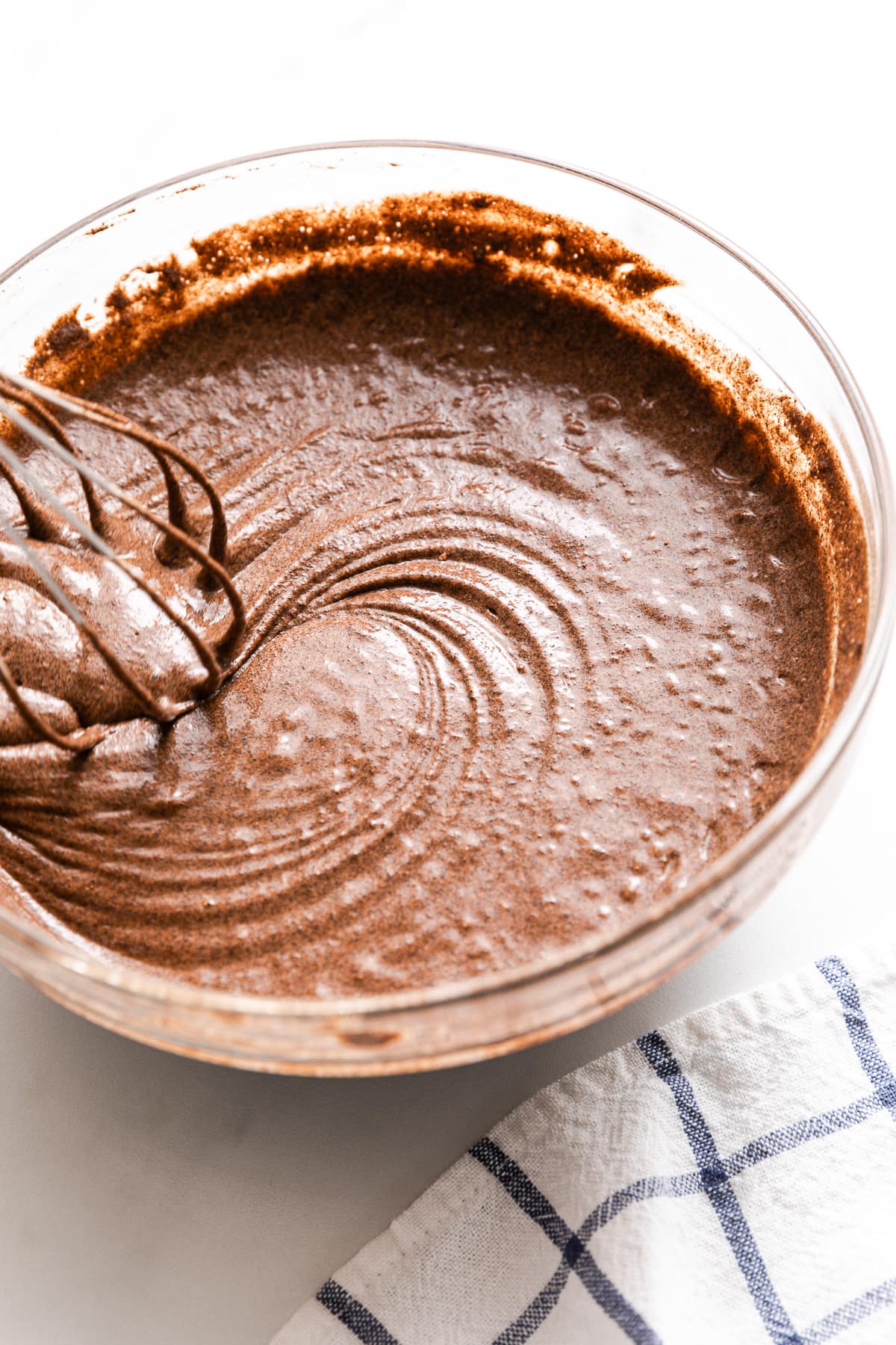 side angle view of buckwheat waffle batter in a bowl.