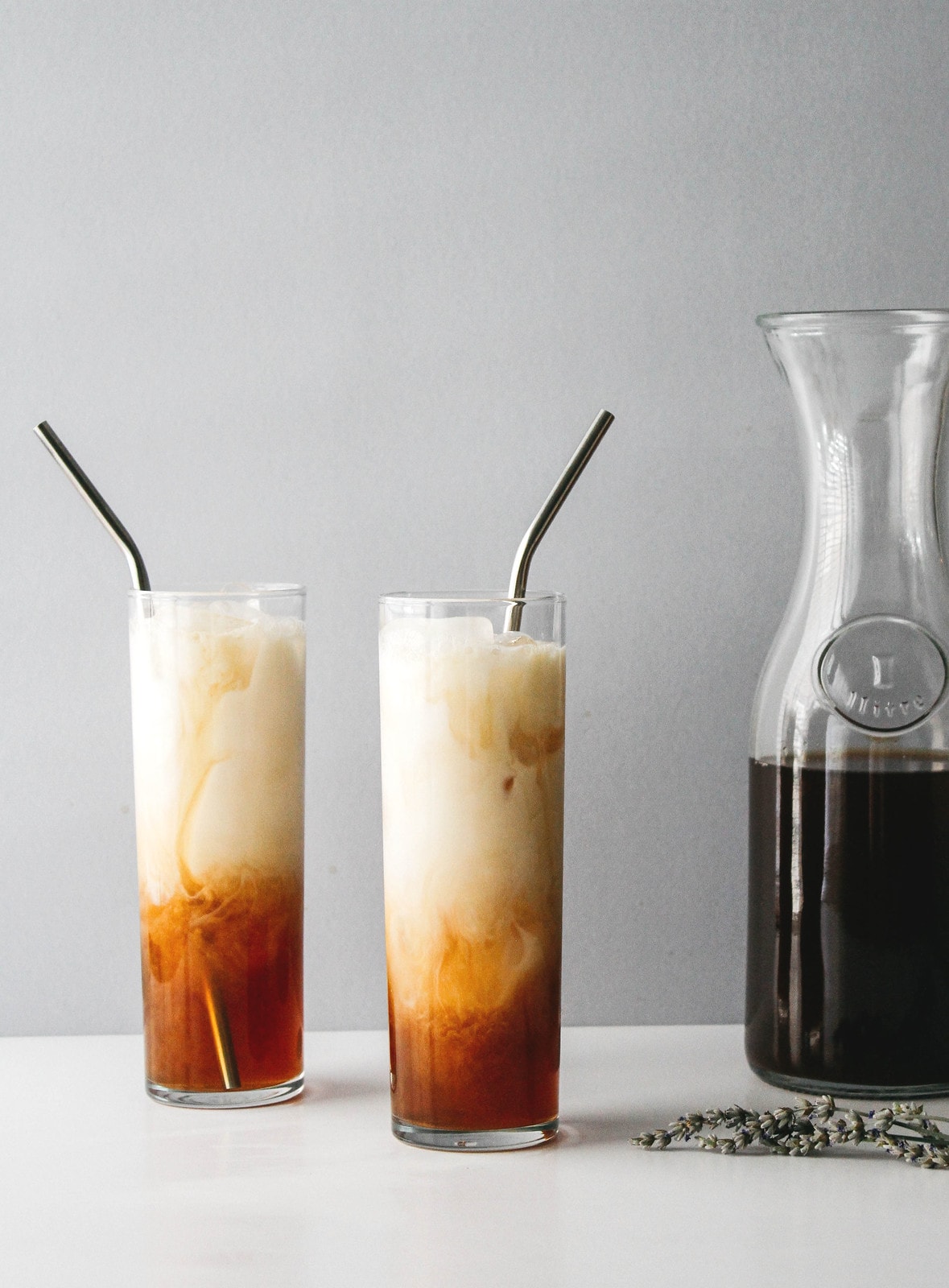 head on view of tall glasses filled with lavender chai tea.