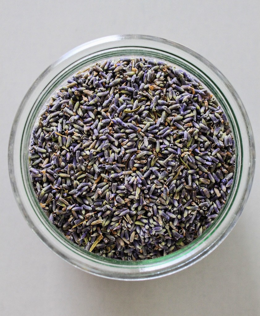 top down view of culinary lavender in a glass jar.