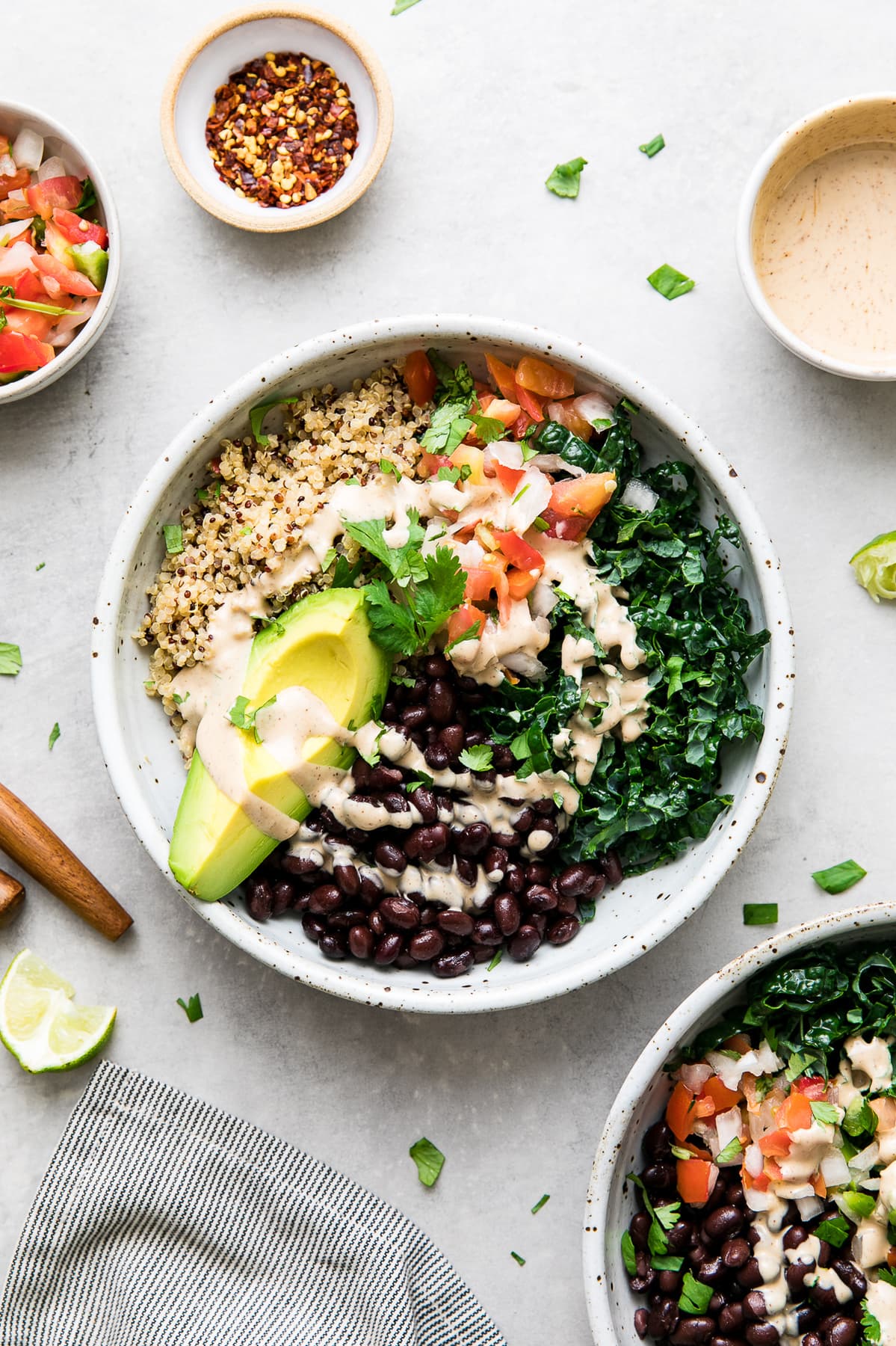 top down view of healthy black bean burrito bowl drizzled with chipotle dressing.