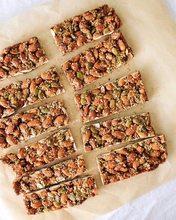 spicy nut and seed bar sliced on a piece of parchment paper