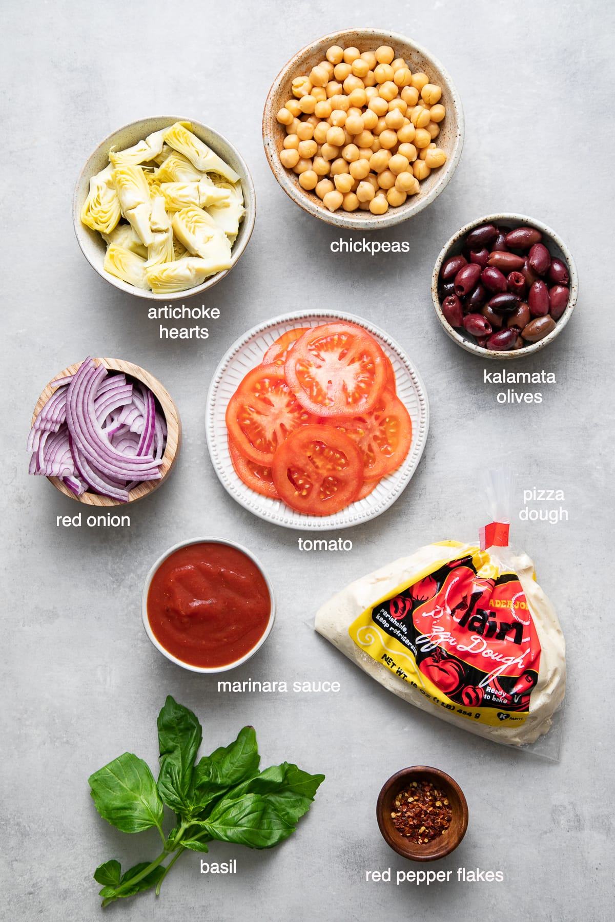 top down view of ingredients used to make mediterranean pizza recipe.