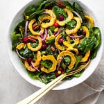 top down view of a large serving bowl filled with roasted delicata squash salad.