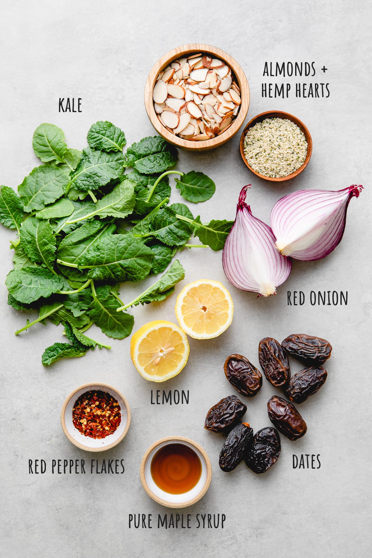 top down view of ingredients used to make healthy kale, date, and almond salad recipe.