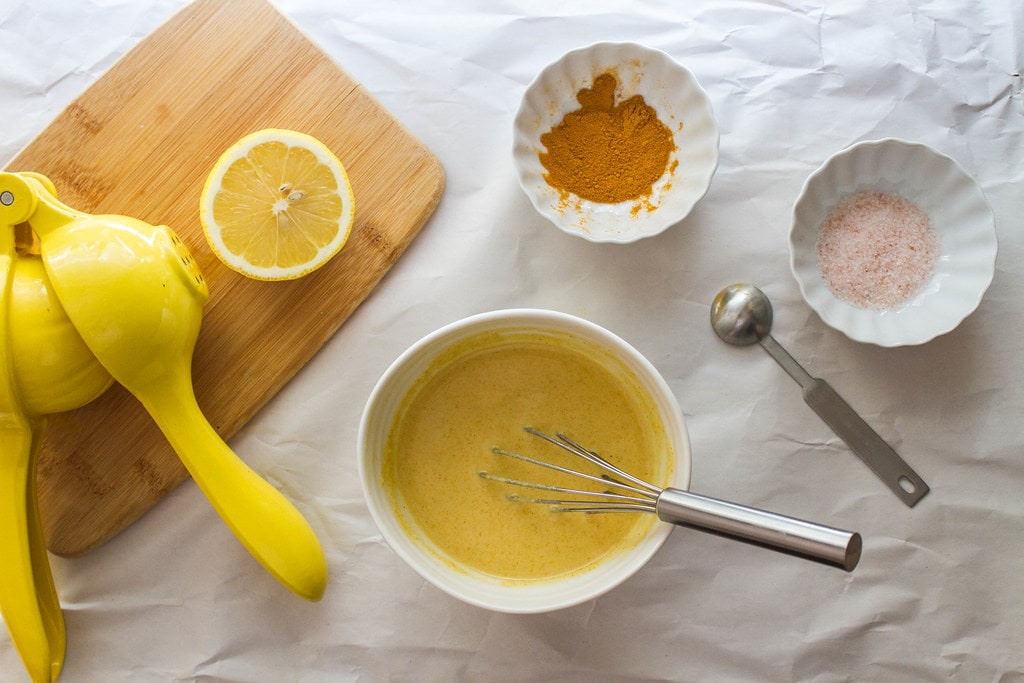 top down view of the process of making turmeric tahini dressing.