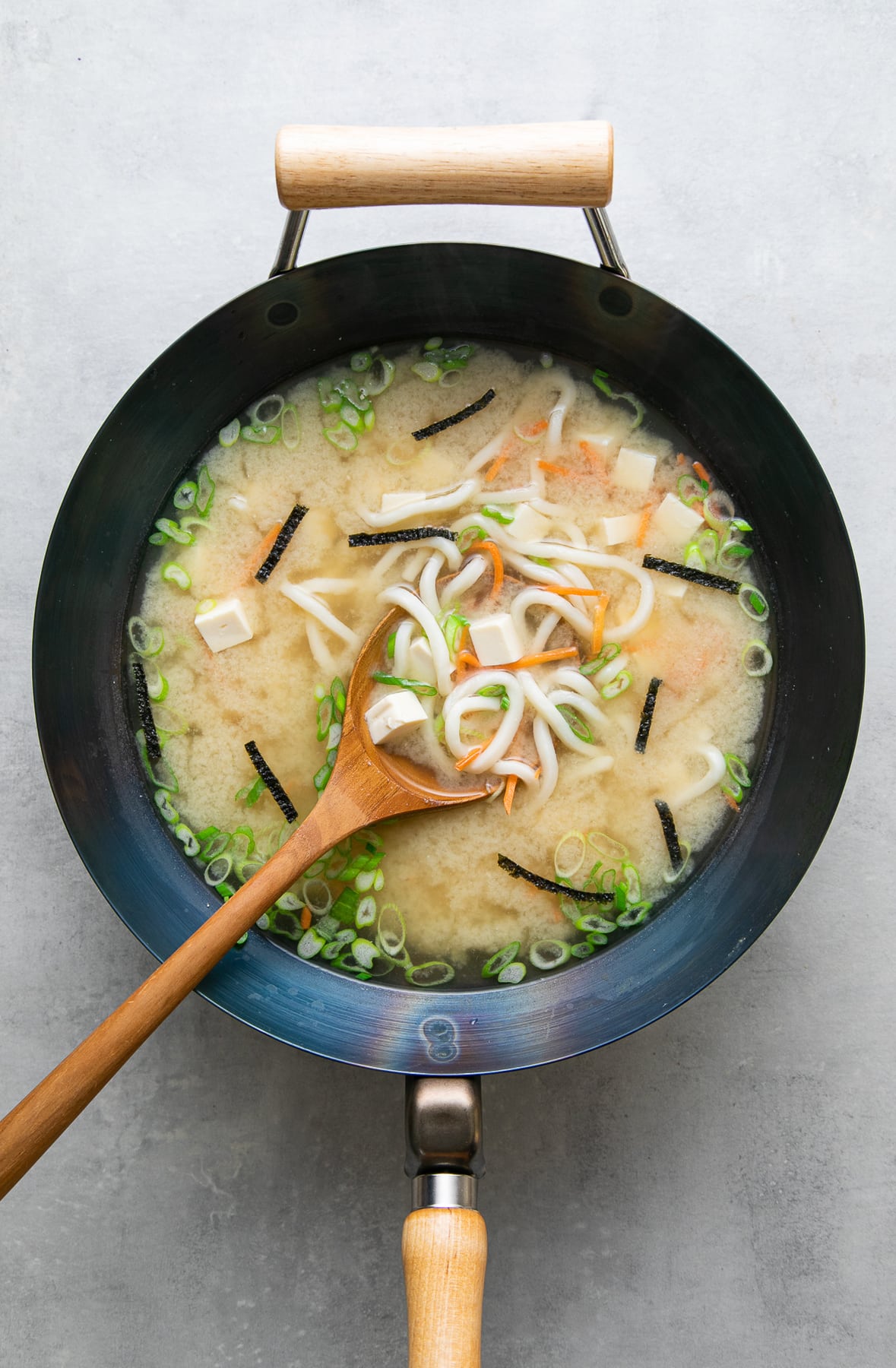 top down view of wok with freshly made vegan miso noodle soup recipe with tofu.