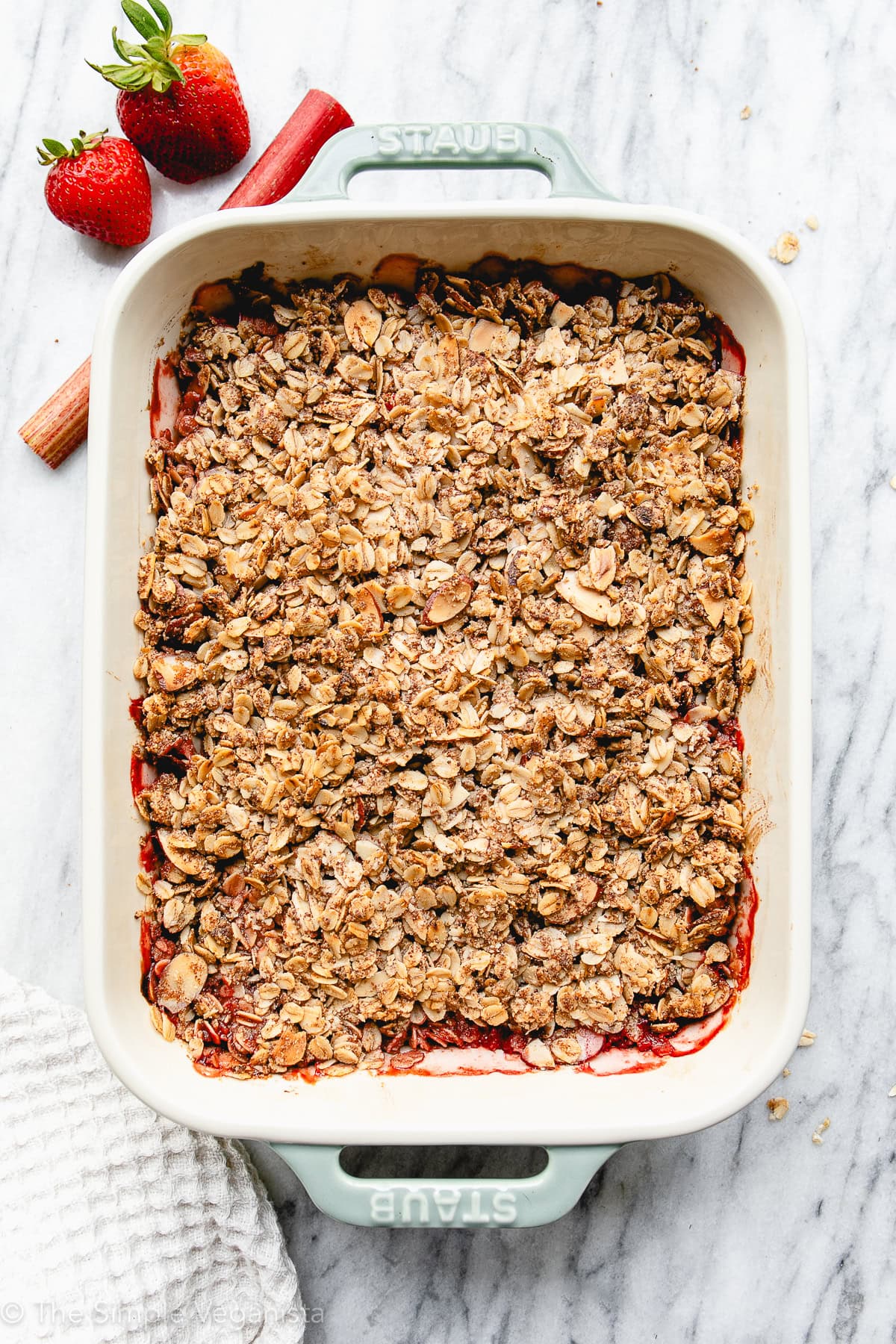 top down view of freshly pulled from the oven strawberry rhubarb in a baking dish.