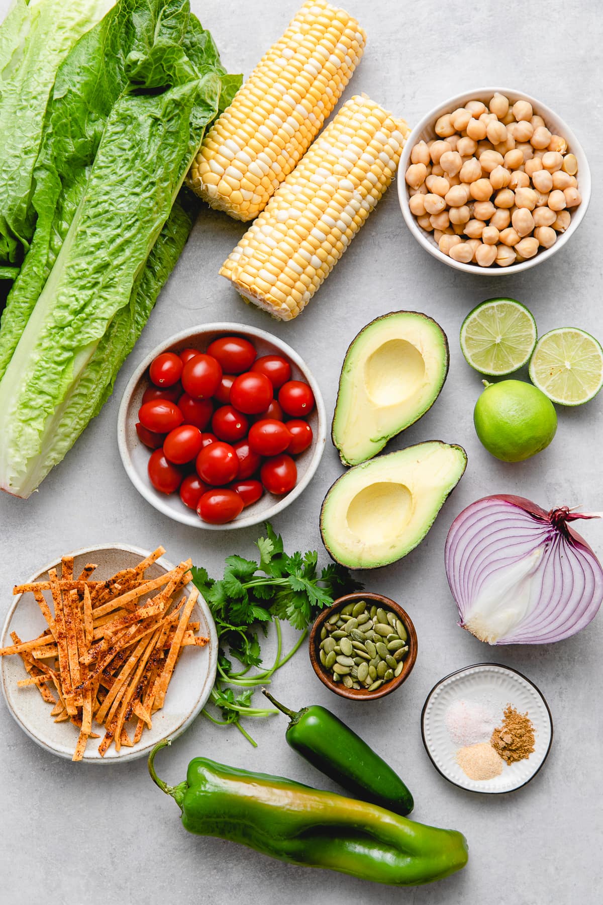 top down view of ingredients used to make southwest chickpea salad with avocado dressing.