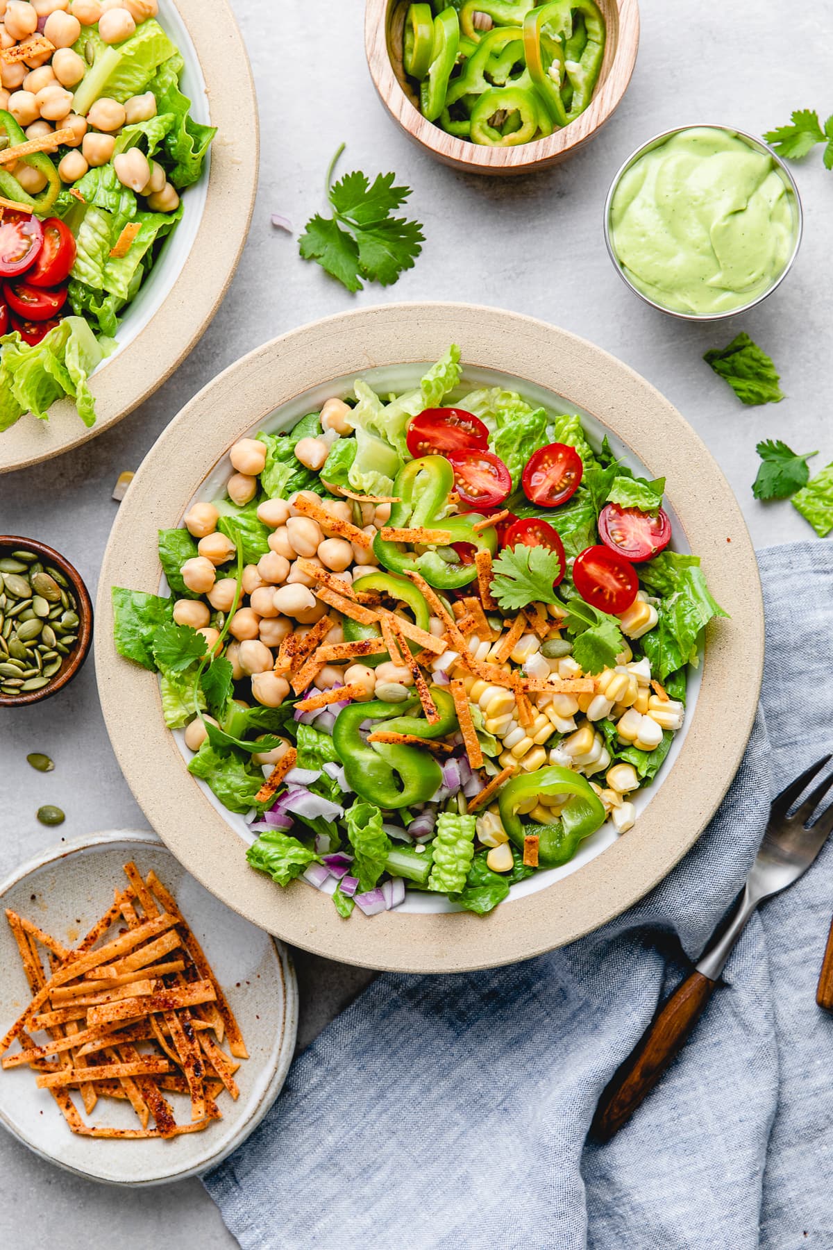 top down view of plated southwest chickpea salad with items surrounding.