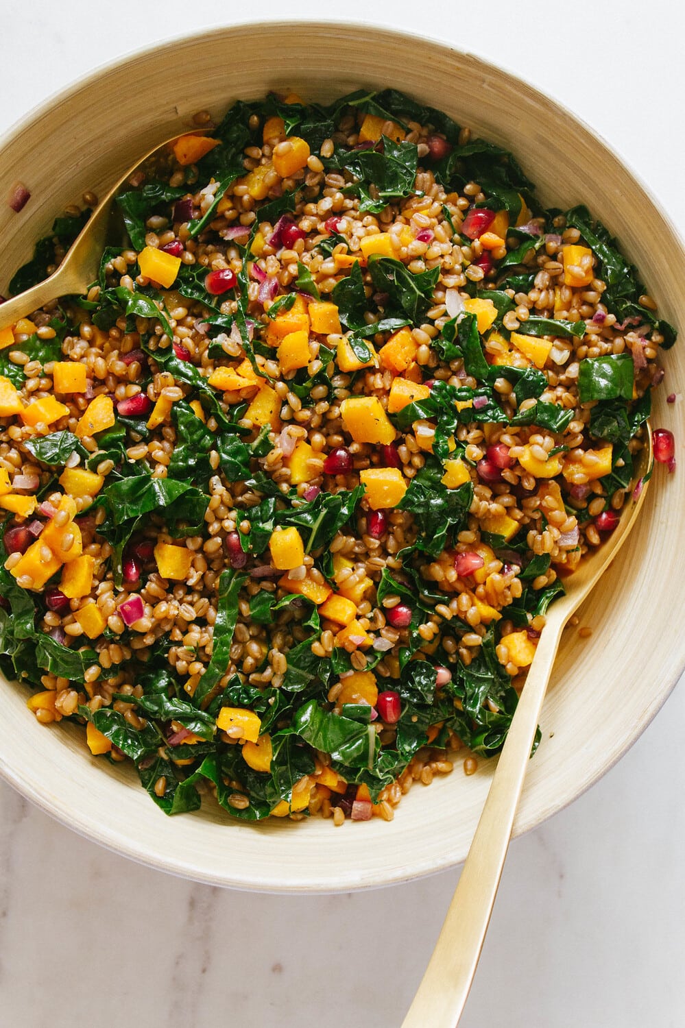 top down view of freshly mixed wheat berry salad with butternut squash.