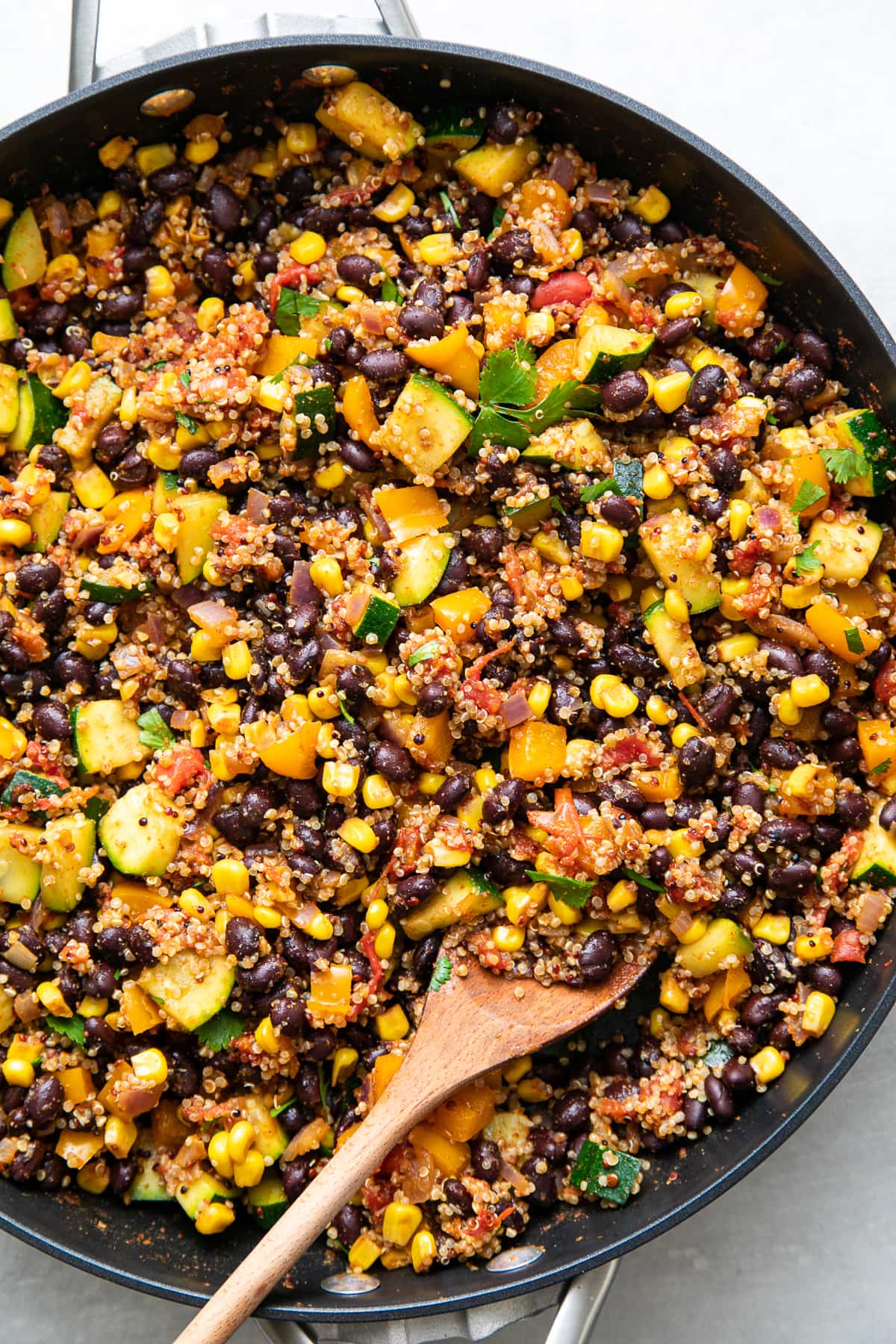 top down view of freshly make black bean quinoa veggie burrito filling.