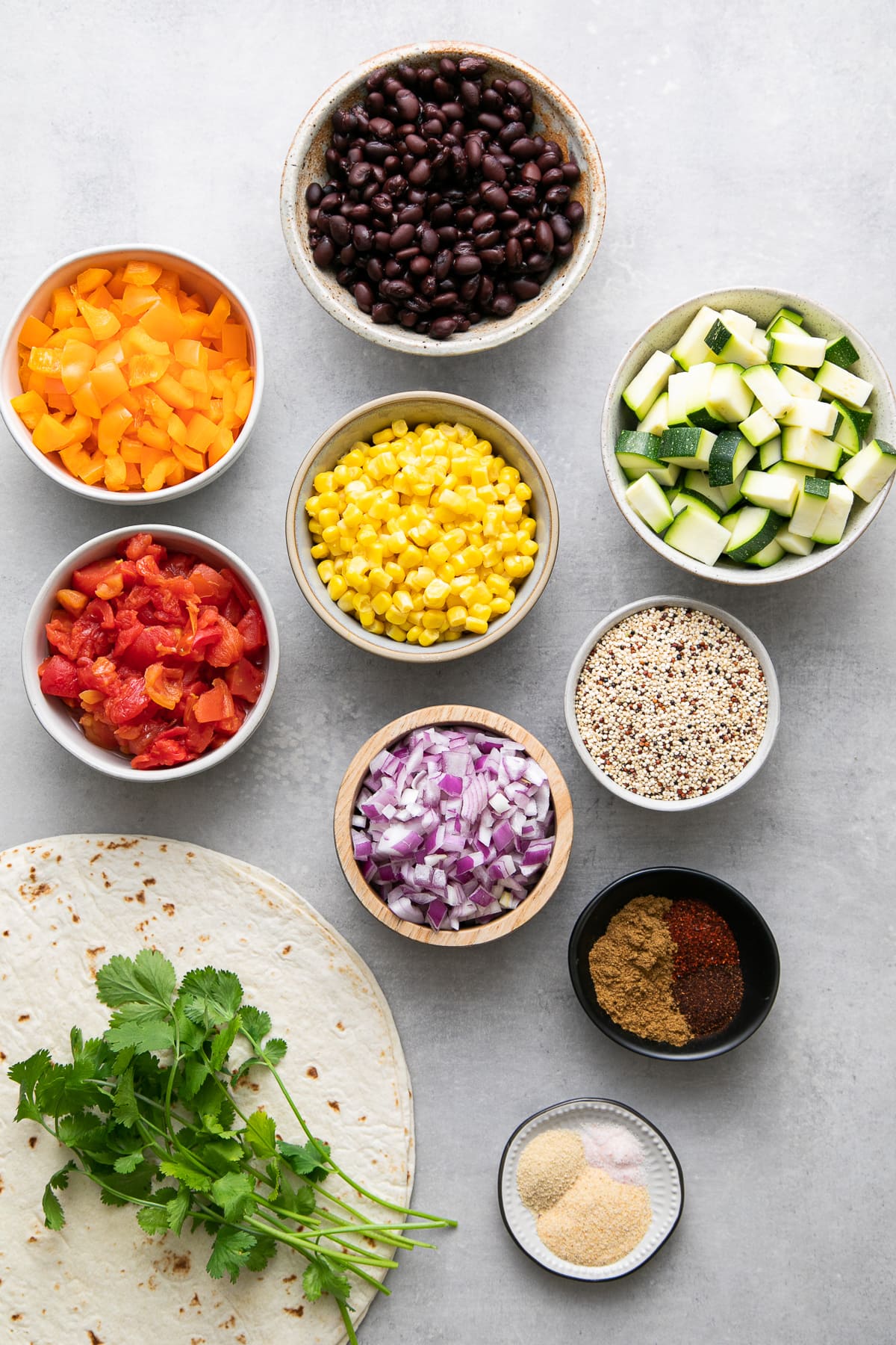 top down view of ingredients used to make black bean quinoa burritos.
