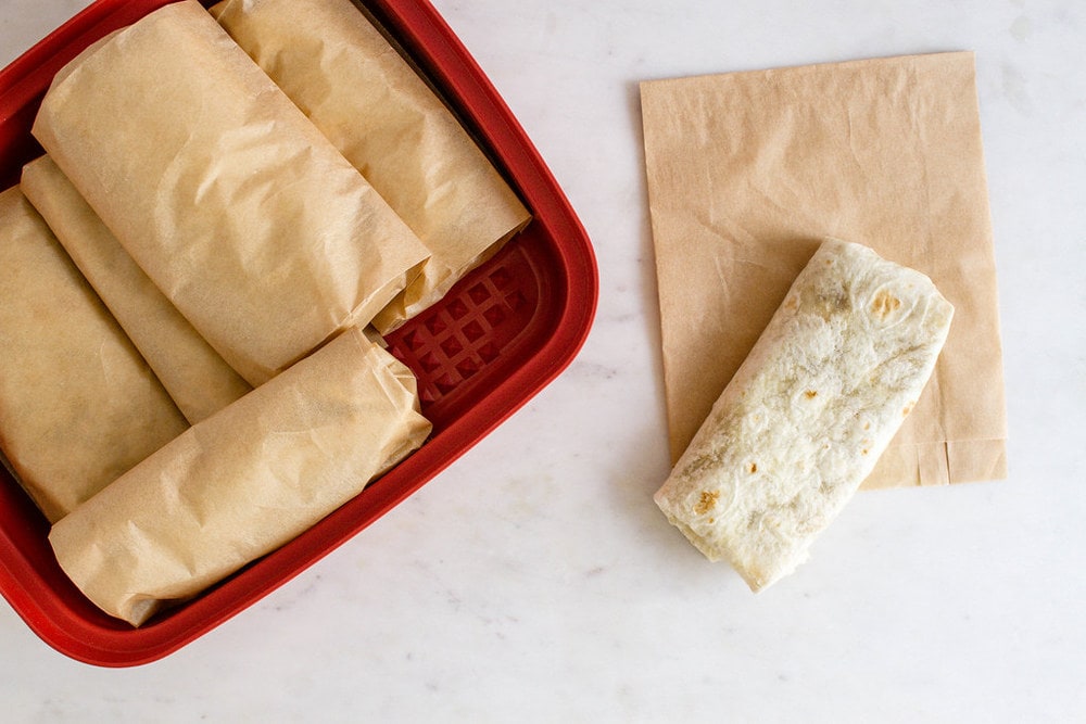 top down view of freezer friendly quinoa black bean burritos wrapped and ready for the freezer.