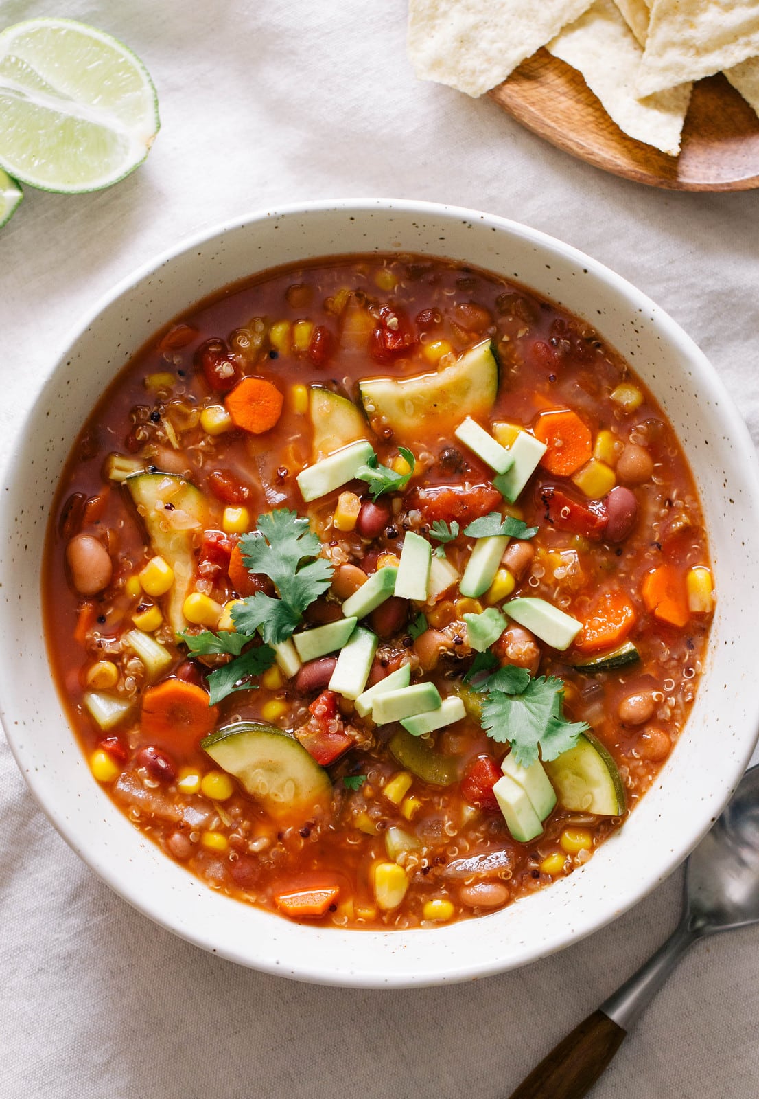 top down view of tex-mex quinoa veggie soup in a bowl.