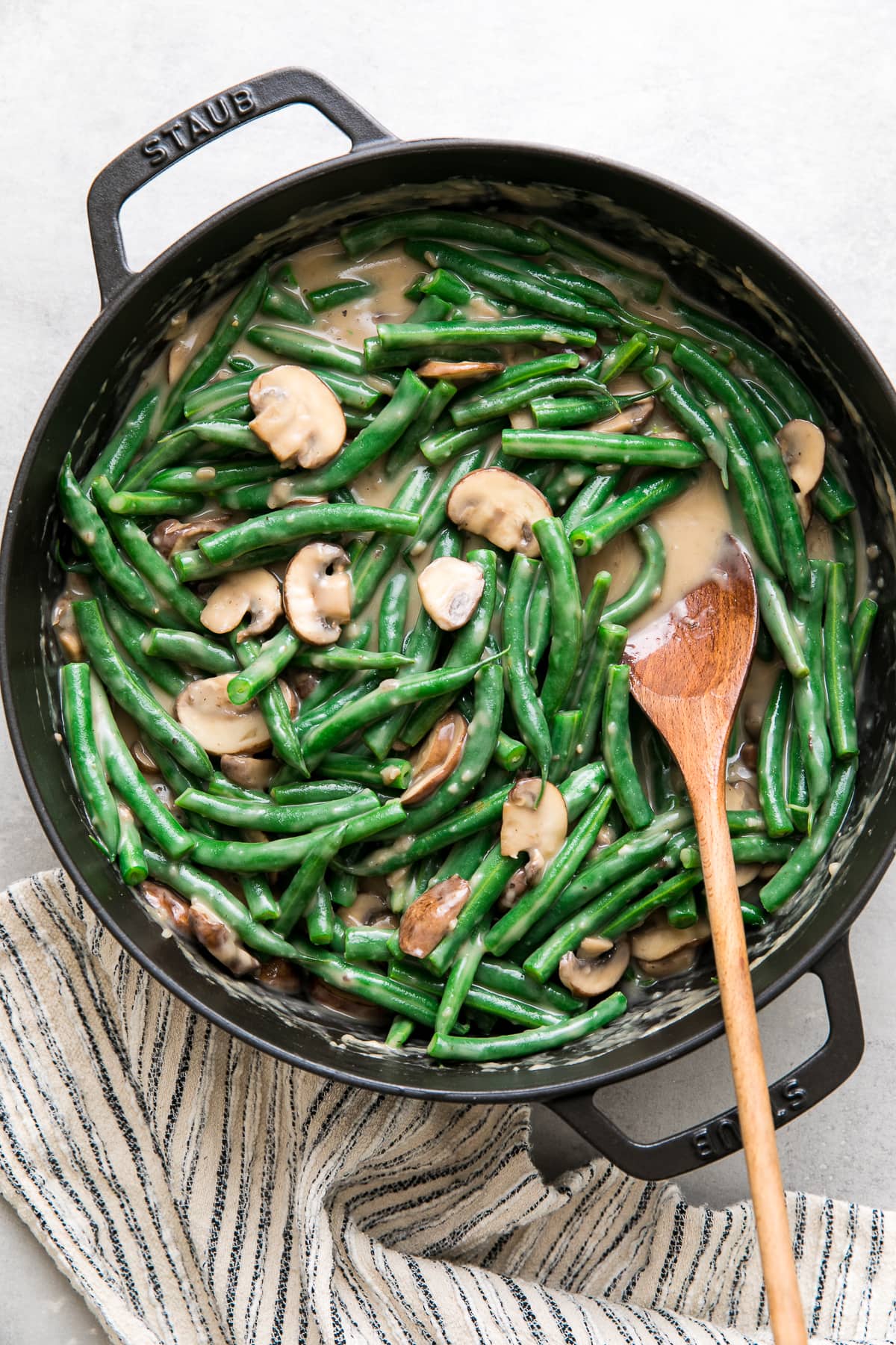 top down view of a pot with freshly made mushroom sauce with green beans mixed in.