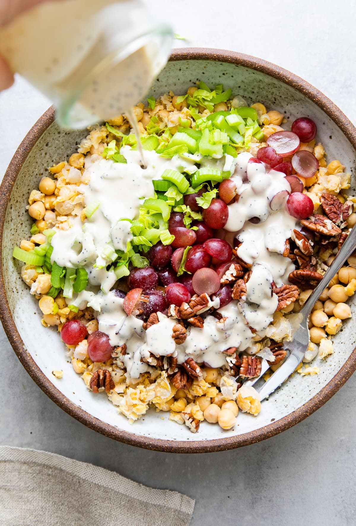 top down view of dressing poured over salad ingredients.