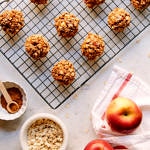 a top down view of a wire rack with cinnamon applesauce oatmeal breakfast cookies are cooking