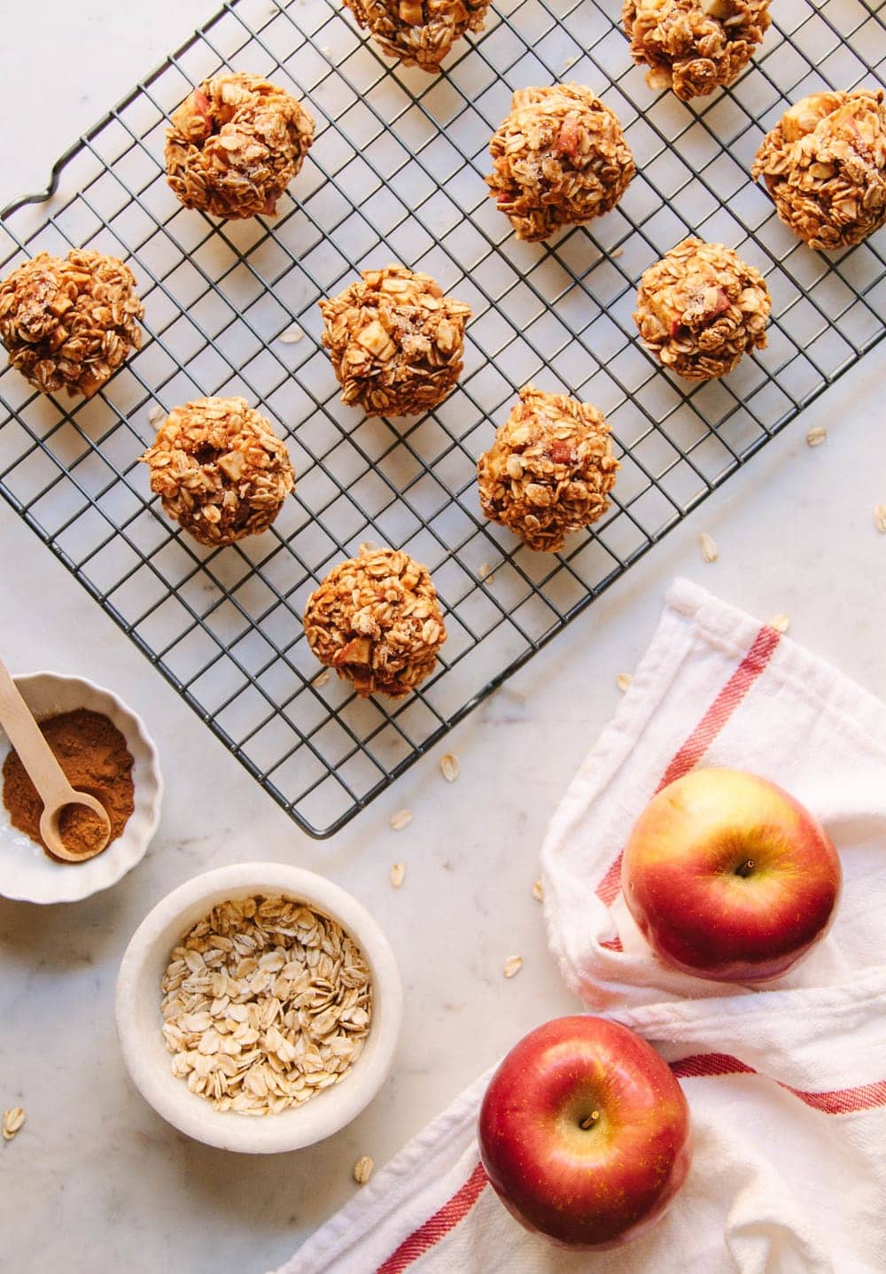 a top down view of a wire rack with cinnamon applesauce oatmeal breakfast cookies are cooking