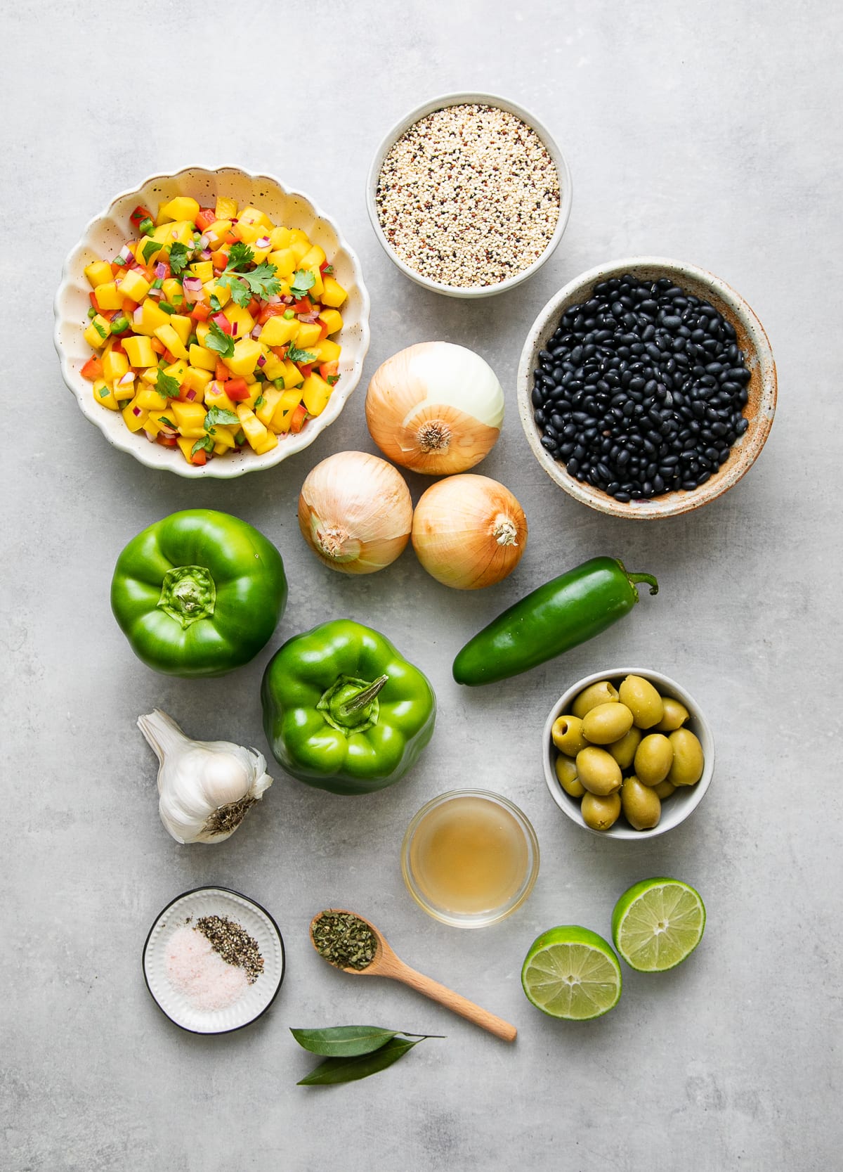 top down view of ingredients used to make cuban black beans with quinoa and mango salsa.