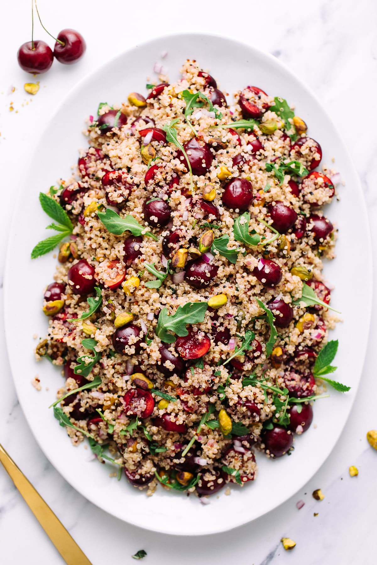 top down view of serving platter with cherry pistachio quinoa salad.