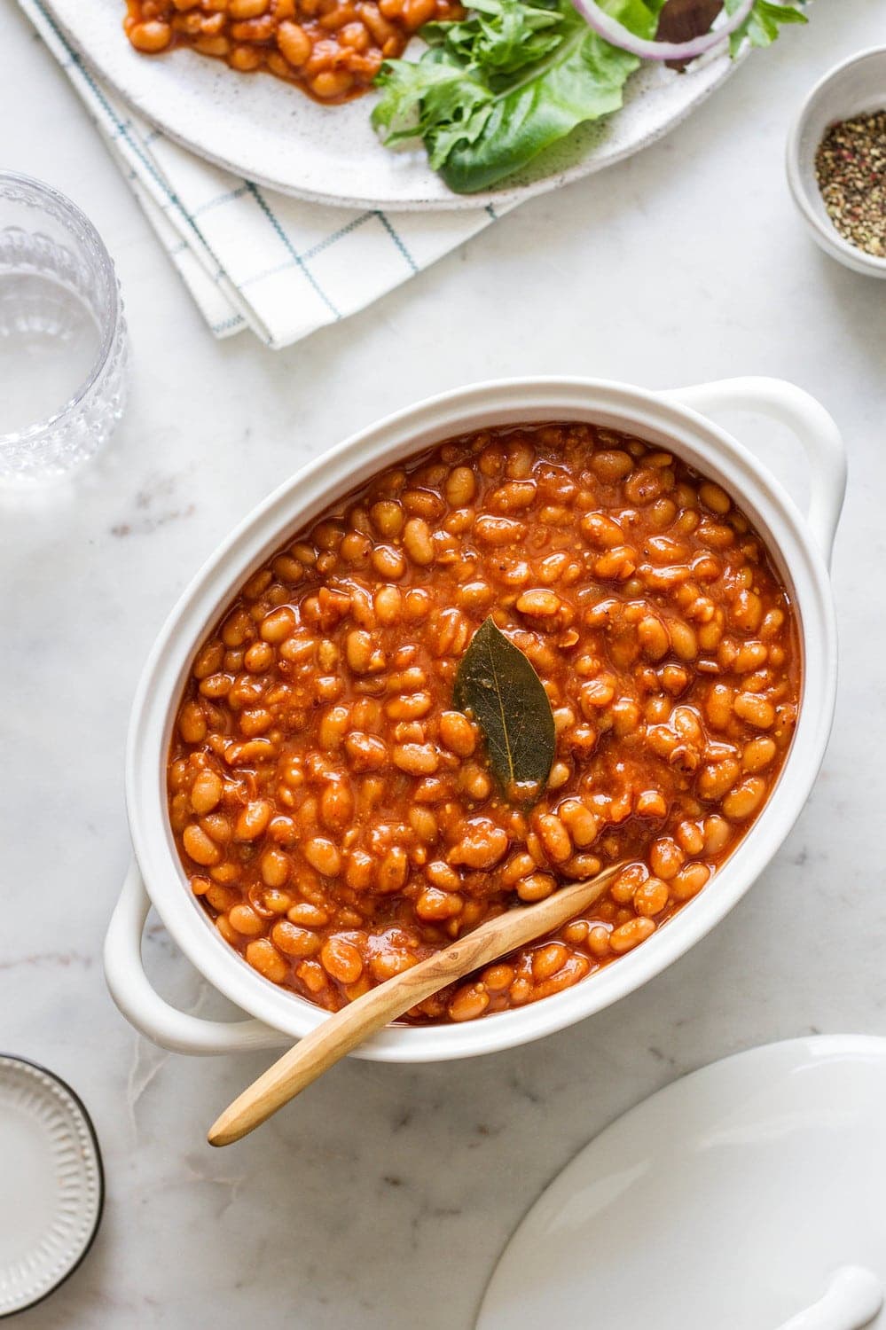 healthy baked beans in a white oval serving dish