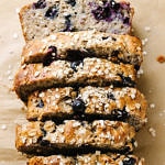 top down view of vegan blueberry banana oat bread cut into slices