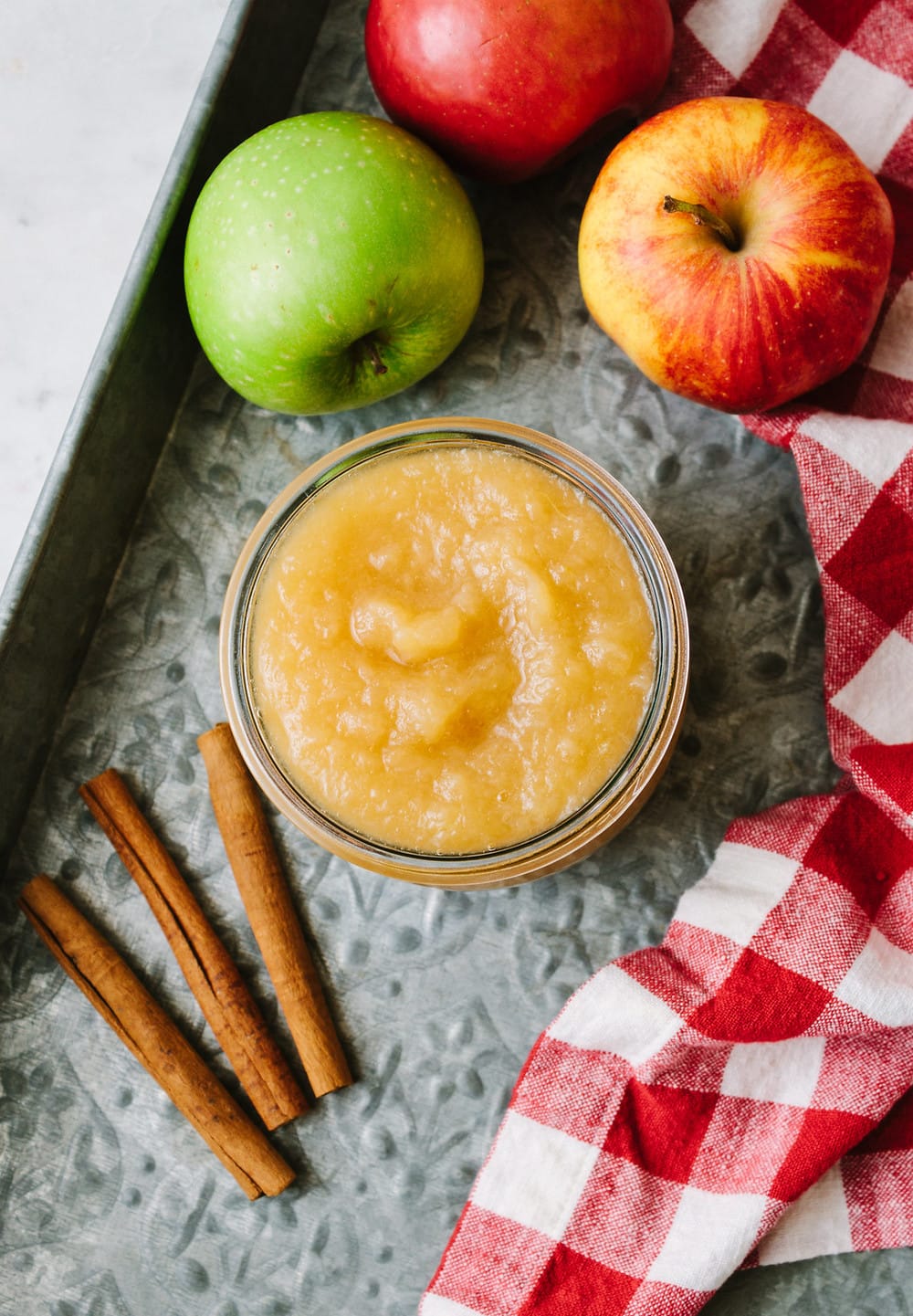 top down view of a glass jar with homemade applesauce