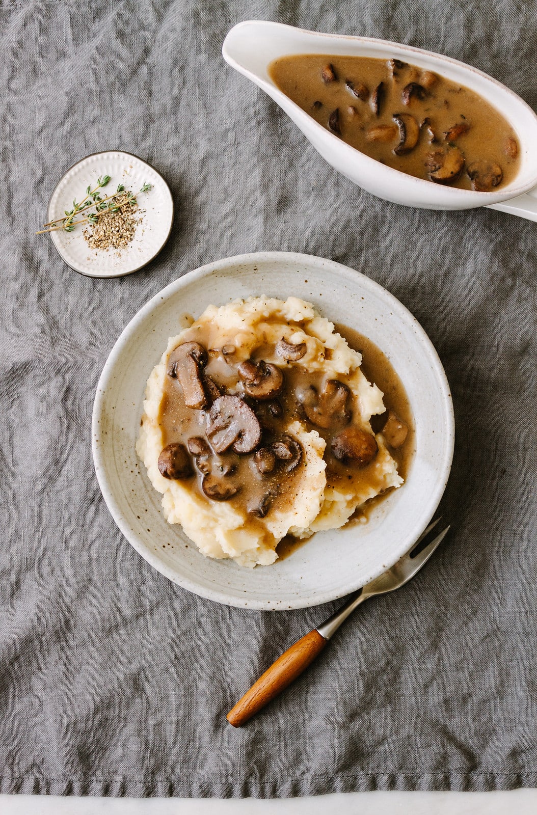 top down view of a bowl of vegan mashed potatoes topped with easy vegan mushroom gravy.