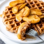 side angle view of cinnamon applesauce waffles with fork.